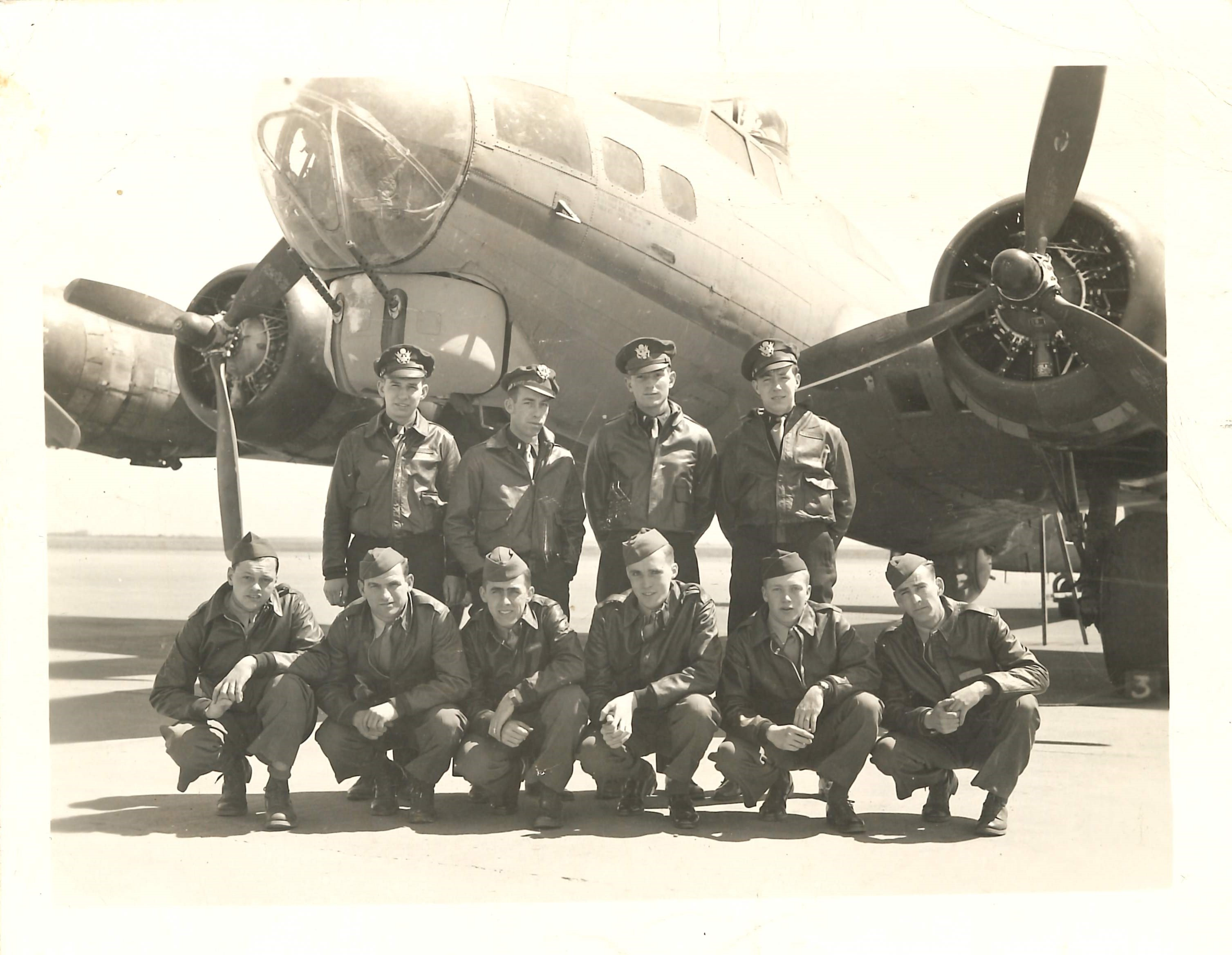 Bomber crew portrait with B-17 Flying Fortress (GN-V, serial number 42-31200) nicknamed "Old Crow" of the  303rd Bomb Group