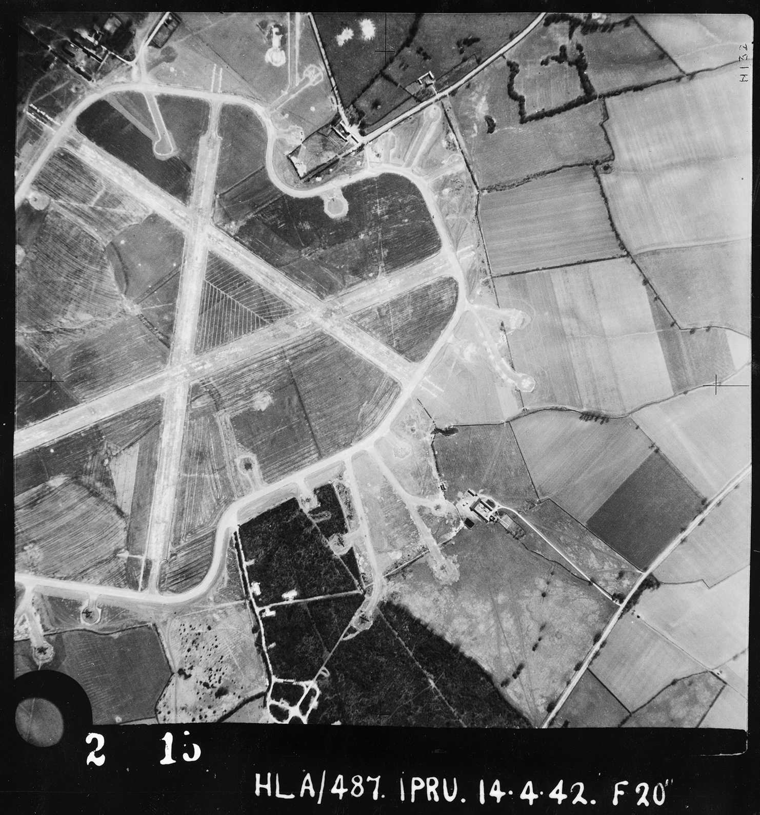 Aerial photograph of Thurleigh airfield looking south, the bomb dump is at the bottom, 14 April 1942. Photograph taken by No. 1 Photographic Reconnaissance Unit, sortie number RAF/HLA/487. English Heritage (RAF Photography).