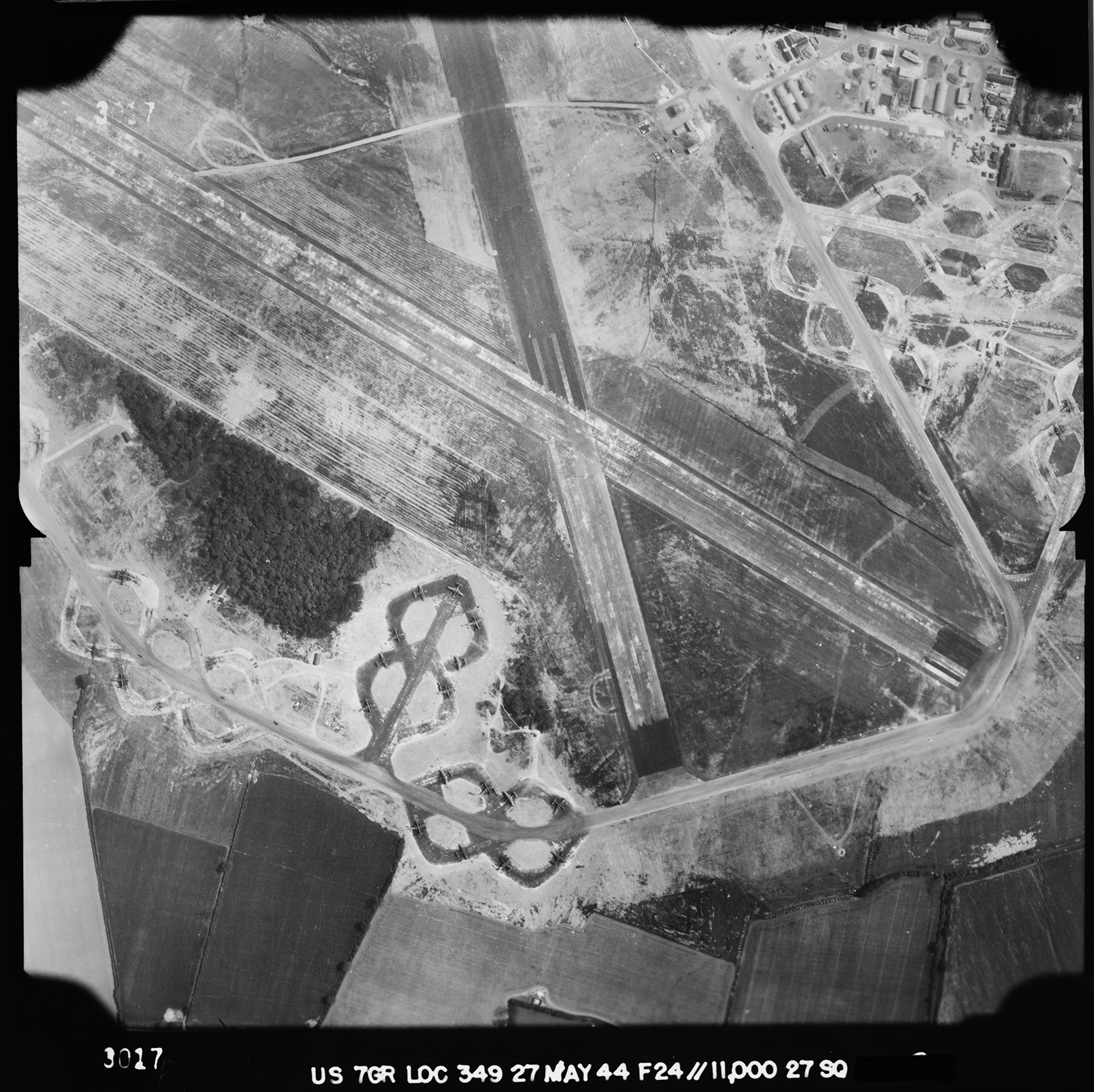 Aerial photograph of the west end of Wethersfield airfield looking east, the technical site is top right, 27 May 1944. Photograph taken by 7th Photographic Reconnaissance Group, sortie number US/7GR/LOC349. English Heritage (USAAF Photography).