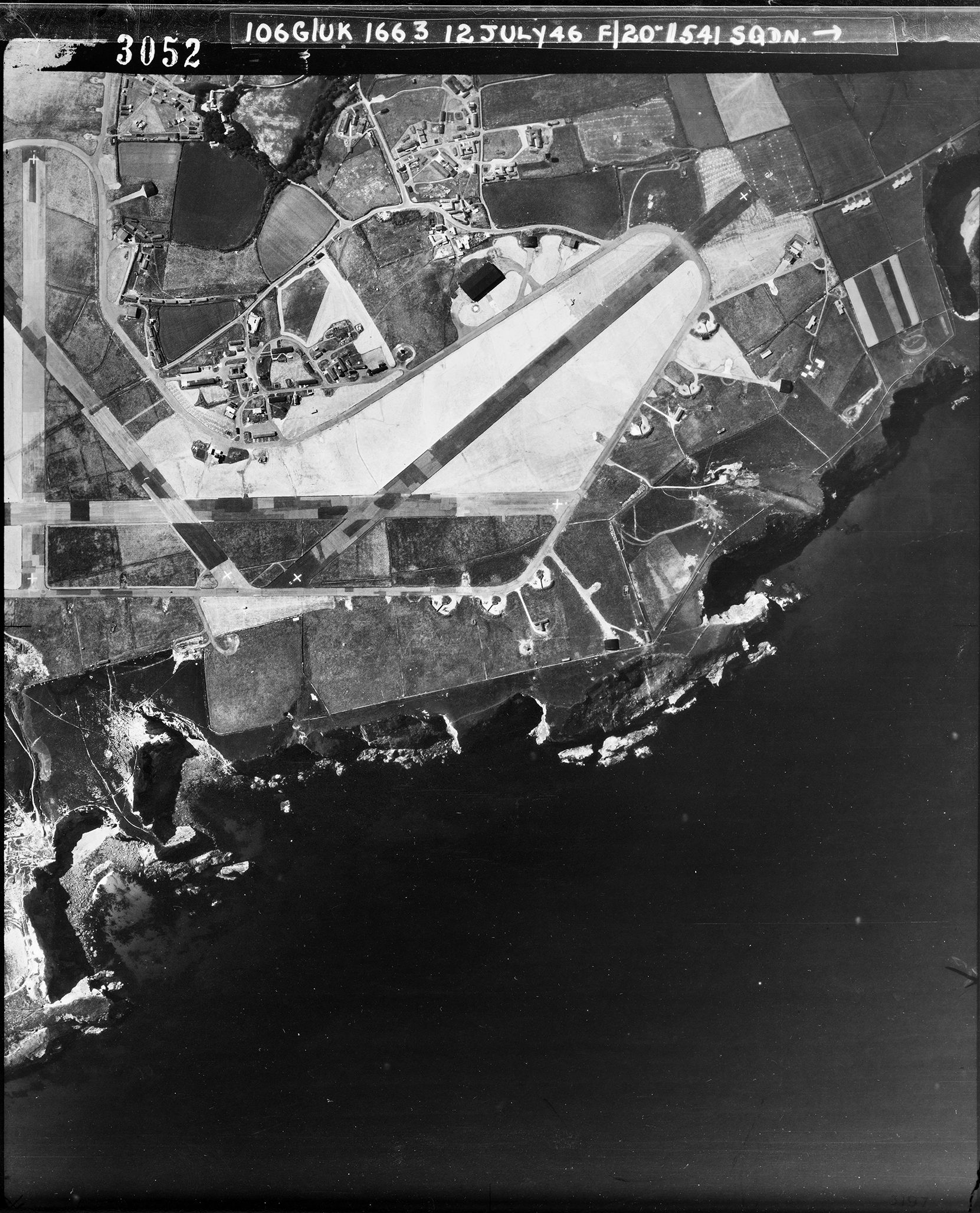 Aerial photograph of Portreath airfield looking south, the control tower is in front of the technical site on the upper left, 12 July 1946. Photograph taken by No. 541 Squadron, sortie number RAF/106G/UK/1663. English Heritage (RAF Photography).