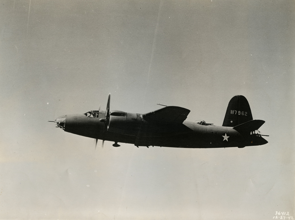 A B-26B Marauder (serial number 41-17962) of the 320th Bomb Group in flight.
Handwritten caption on reverse: '320BG, B-26B-3.' On reverse: Martin B-26 and The Glenn L. Martin Co. Baltimore MD. [Stamps].