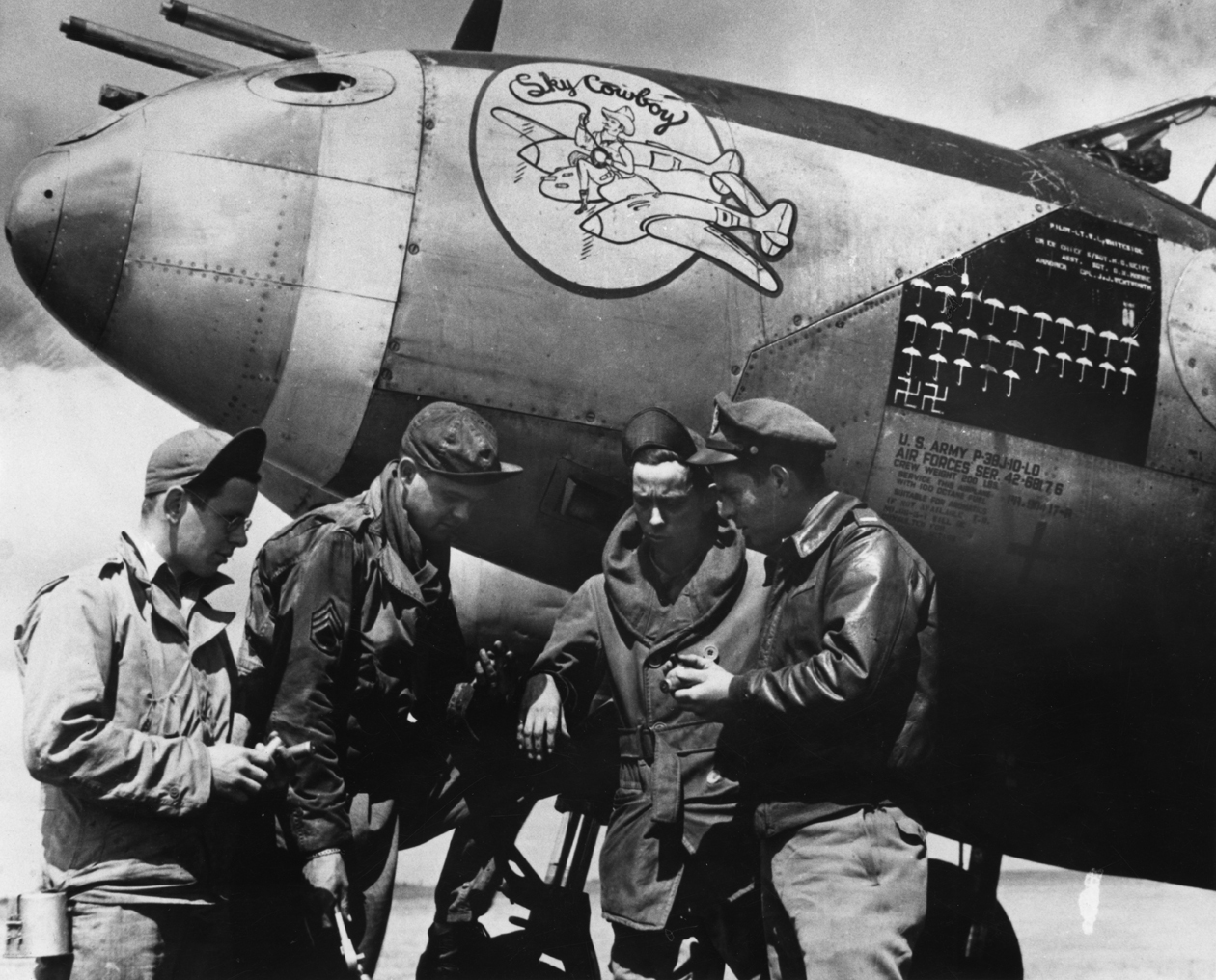 Pilot and ground crew of P-38J Lightning (serial number 42-68176), named by the crew "Sky Cowboy". Pilot of the aircraft was First Lieutenant Walker L. Whiteside, Crew Chief was Staff Sergeant Harry G. Keife and Armorer was Corporal James J. Wentworth. They were all part of the 77th Fighter Squadron, 20th Fighter Group, based at Kings Cliffe air base.