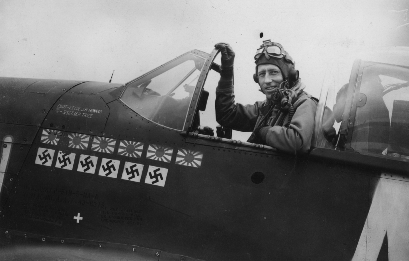 Lieutenant-Colonel James H Howard, of the 354th Fighter Group in the cockpit of his P-51 Mustang. Image stamped on reverse: 'Central Press Ltd.' [stamp], 'Passed for publication 25 Apr 1944.' [stamp] and '317270.' [Censor no.] A printed press story was previously attached to the reverse however this has been removed. Printed caption on reverse: 'Lt col Howard, a famous pilot with US IXth Fighter Command, has six Japs and Six Nazis to his list of kills whilst on a recent mission to Berlin [annotated: 11/1/