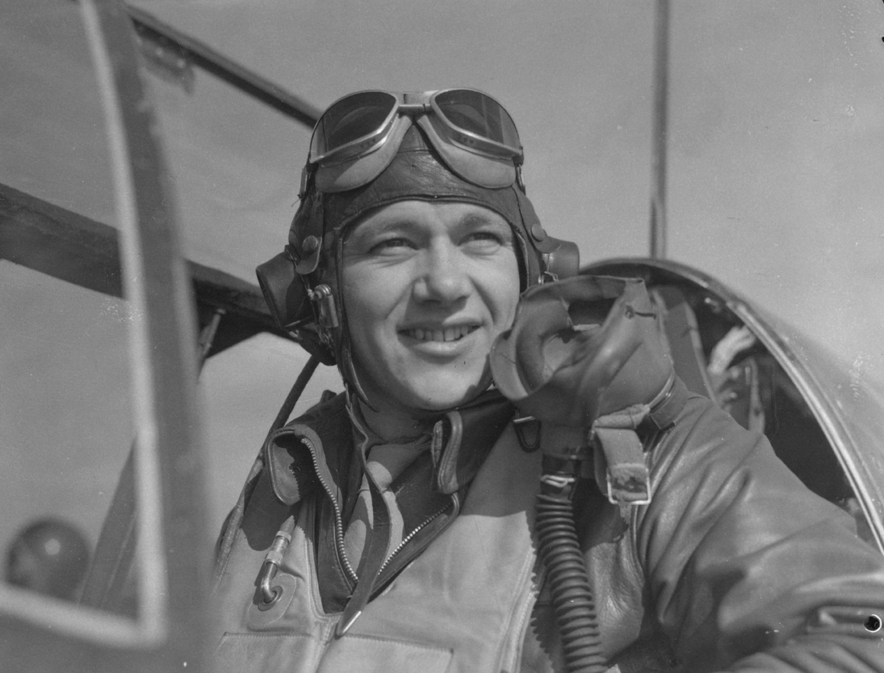 Capt. Nicholas Megura of the 334th Fighter Squadron, 4th Fighter Group, in cockpit, at Debden air base, 8 March 1944. Caption on reverse: Pilots of the P-51s. Lt.Col. Donald J. M. Blakeslee's Mustang Group. Associated Press photo shows: Lt. Nicholas Megura, aged 24, of 108 Broad Street, Ansonia, Conn., has been on first two raids over Berlin and shot down two planes each time. WOR265648. 8344EM. Stamp (Passed for publication - General Section, Press & Censorship Bureau, 9 March 1944)