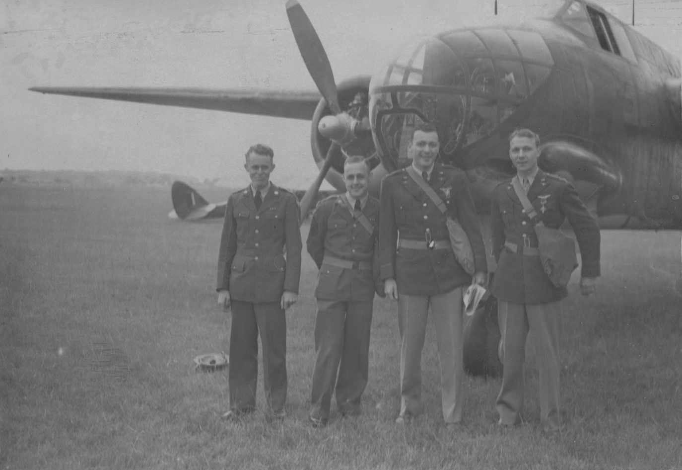 A bomber crew of the 301st Bomb Group with their A-20 Havoc after being awarded medals. From left to right, they are Sergeant B.B. Cunningham of Tupelo, Missouri; Sergeant R.L. Golay of Fredonia, Kansas; Second Lieutenant M. Dorton of Long Beach; and Major Charles C. Kegelman. Image stamped on reverse: 'Passed for Publication 11 Jul 1942.' [stamp], 'Not to be published until 12/7/42.' [stamp], 'Keystone Press.' [stamp], 'USA (NIR)CCC.' [written annotation] and '209807.' [Censor no.] Printed caption on rev