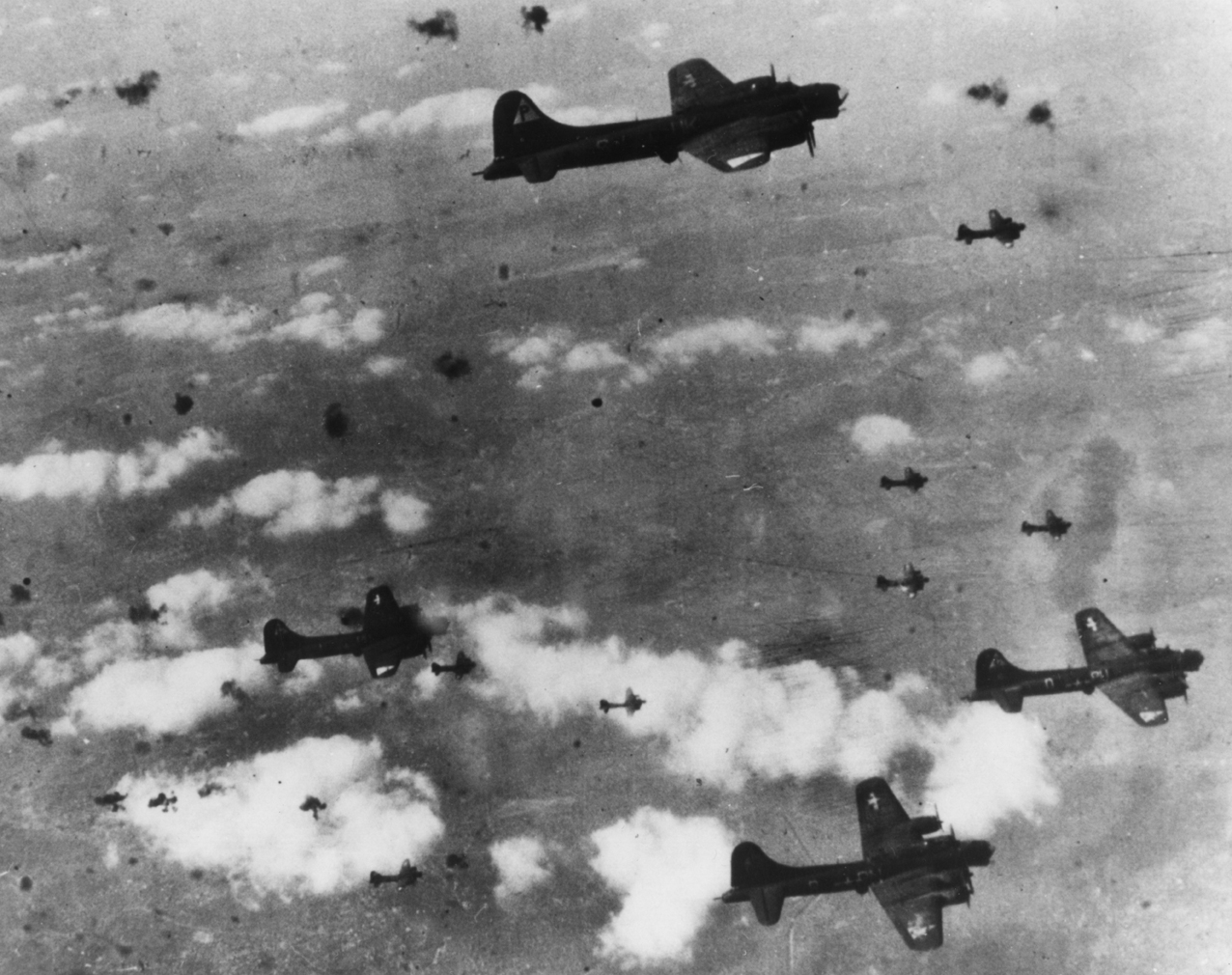 B-17 Flying Fortresses of the 384th Bomb Group fly through flak.