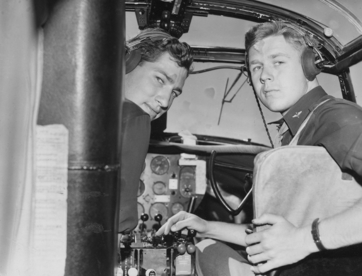 Lieutenant James T. Wilson and Lieutenant Robert J. Owen of the 386th Bomb Group in the cockpit of their B-26 Marauder. Image stamped on reverse: 'Not to be published.' [stamp], 'Ministry of Information 19 Aug 1943.' [stamp] nand '279545.' [Censor no.] Printed caption on reverse: 'AT THE US MARAUDERS BASE. The B-26 Marauders, American super medium bombers are operating now from bases in Britain. This series of pictures shows various scenes at the airfield where the ground crew and the fliers work together