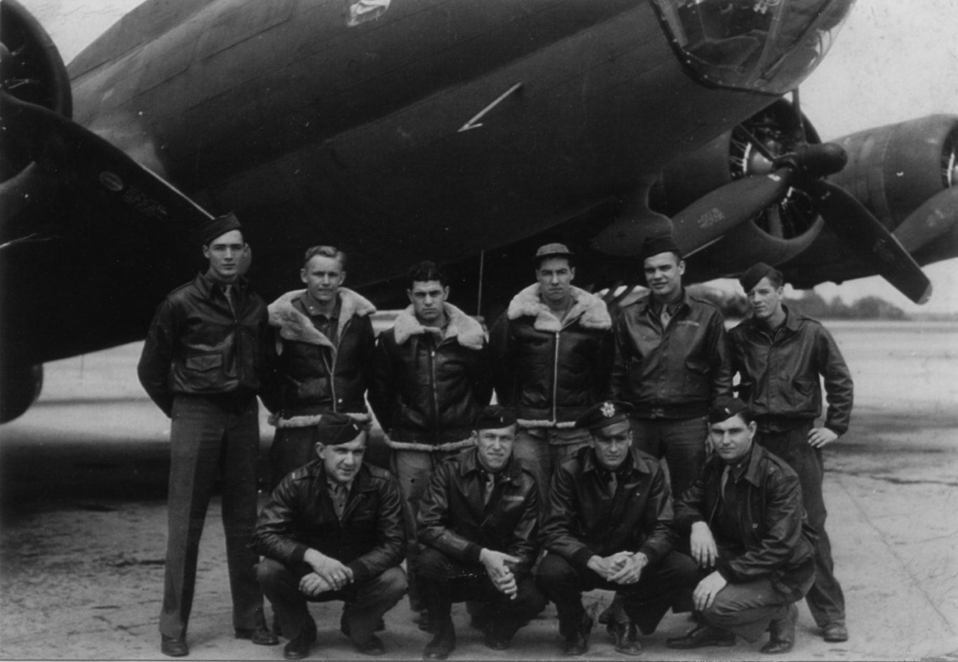 A bomber crew of the 388th Bomb Group with their B-17 Flying Fortress (serial number 42-3289) nicknamed "Wolf Pack". A veteran's son has enclosed a letter with the print: '[Left to right standing:] Clayton Junkin, Bruno Miazgowicz, Rolland Allard, William Shawley, William Bemmie, Chris Ivanoff, [left to right kneeling:] Frank Boyer, Edward A Wick, Allan B Lemley, (?) Mack. This picture is of the original crew of "Wolf Pack" of the 562nd Squadron of the 388th Bomb Group, the Mighty Eighth Air Force. Edward