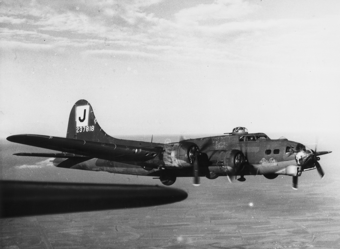 A B-17 Flying Fortress (serial number 42-37818) nicknamed "Pub Pete" of the 390th Bomb Group. Handwritten caption on reverse: '390 BG.'