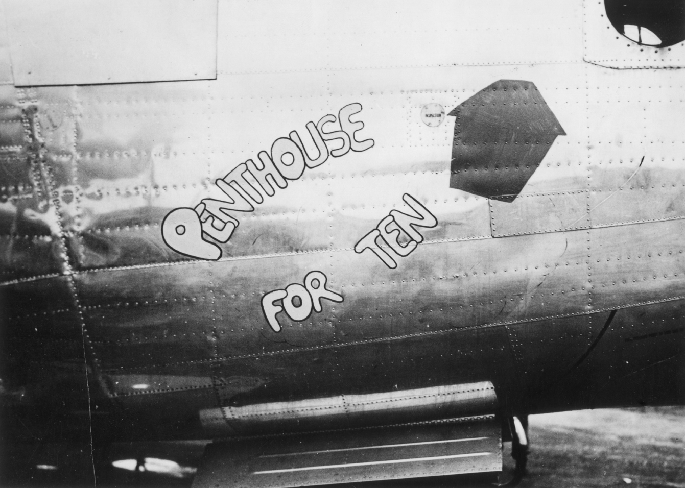 The nose art of a B-24 Liberator (serial number 42-95268) nicknamed "Penthouse for Ten" of the 466th Bomb Group. Handwritten caption on reverse: 'B-24, 466 BG Attlebridge.'