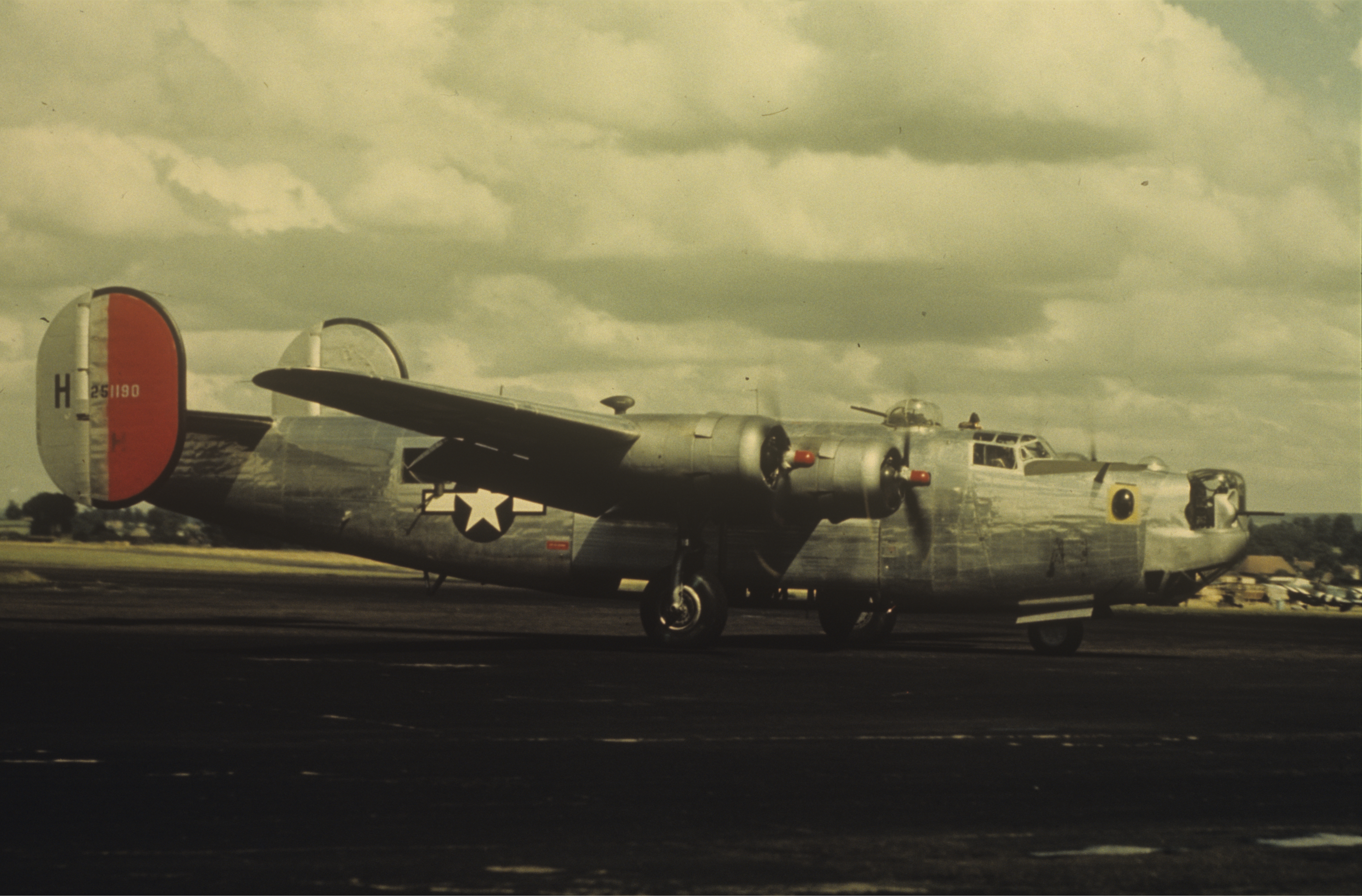 A B-24 Liberator (serial number 42-51190) nicknamed "Ann" of the 34th Bomb Group at Mount Farm. Image by Robert Astrella, 7th Photographic Reconnaissance Group. Written on slide casing: '34 BG, Mount Farm.'