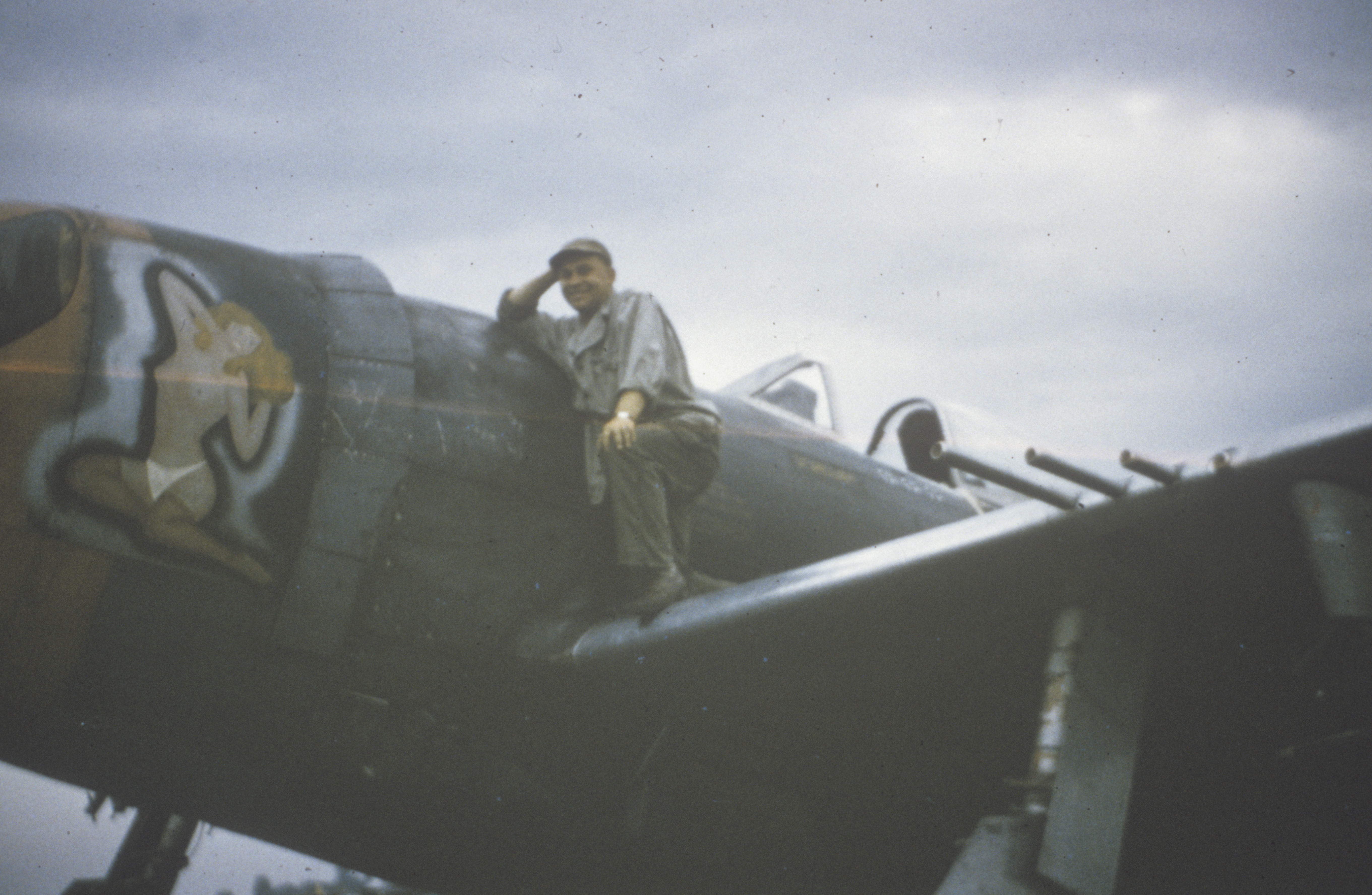 A member of ground crew for the P-47 Thunderbolt aircraft (serial number 44-21199), named "Josephine My Flying Machine" of the 56th Fighter Group. Handwritten on slide:"421199 leo Battista Leo Battista 3" Printed on slide:" SEPT 1997 12"