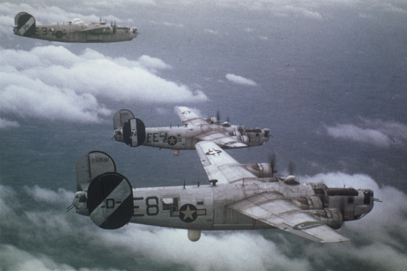 A pathfinder B-24 Liberator (serial number 42-51681) of the 453rd Bomb Group flies in formation with a fellow Liberator of the 453rd and and a pathfinder Liberator of the 445th Bomb Group. Image via Alan Rowsell.