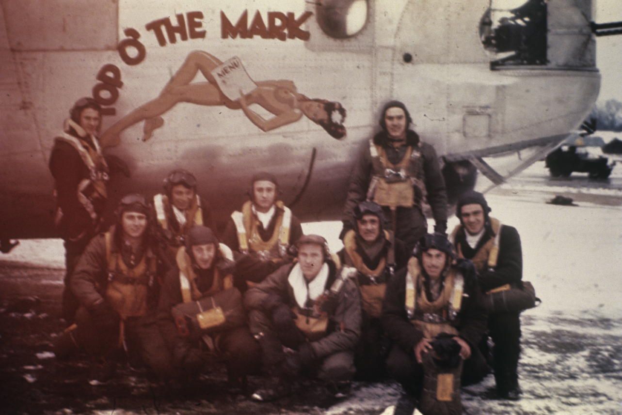 A bomber crew of the 458th Bomb Group with their B-24 Liberator (serial number 42-51110) nicknamed "Top O' the Mark.' The crew are: (back row, left to right) Carl Johnson - Nose Gunner, Chuck Frazer - Gunner, Charles Gretz - Top Turret Gunner, "Bubba" Monroe - Co-Pilot, (front row, left to right) Dick Eselgroth - Navigator, Al Miller - Bombardier, Billy Duke - Pilot "Luke" Lucas - Radio Operator, Baldamore Garcia - Engineer, "Pan" Panarese - Tail Gunner . Image via RM Eselgroth. Written on slide casing: '