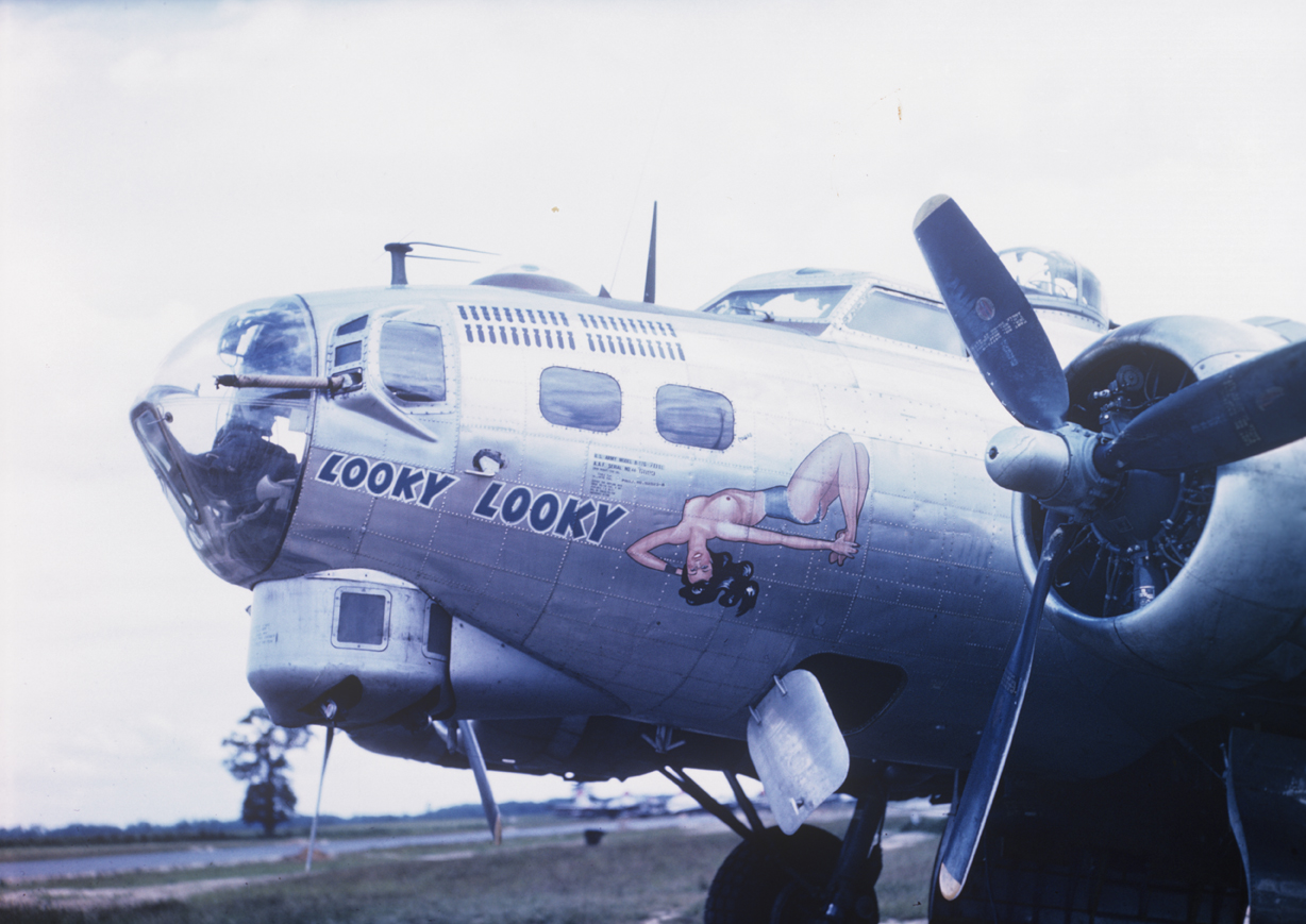 The nose art of a B-17 Flying Fortress (serial number 44-6893) nicknamed "Looky Looky" of the 490th Bomb Group. Image by Captain Arnold Delmonico, photographic officer 490th Bomb Group. Written on slide casing: 'Looky Looky.'