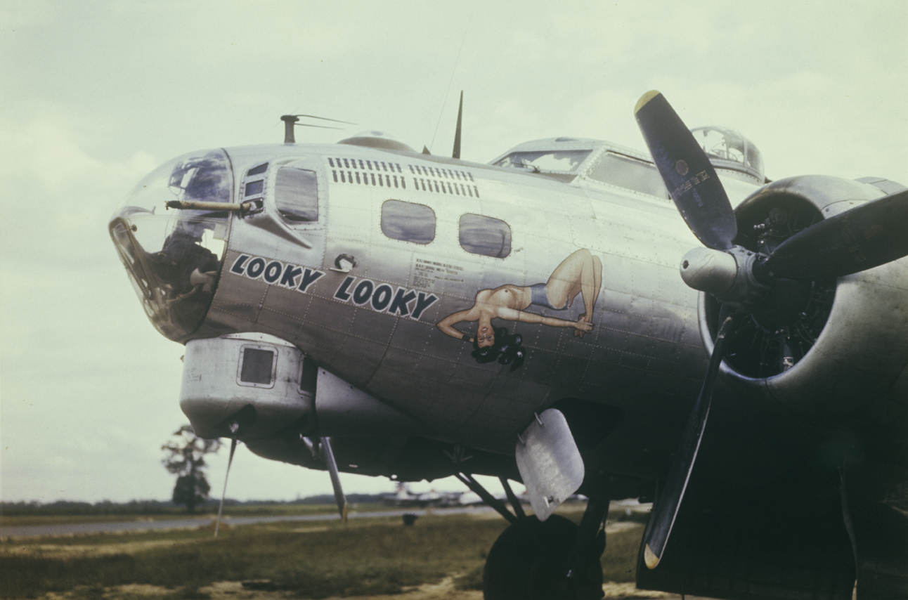 The nose art of a B-17 Flying Fortress (serial number 44-6893) nicknamed "Looky Looky" of the 490th Bomb Group. Image by Captain Arnold Delmonico, photographic officer 490th Bomb Group. Written on slide casing: 'Looky Looky.'