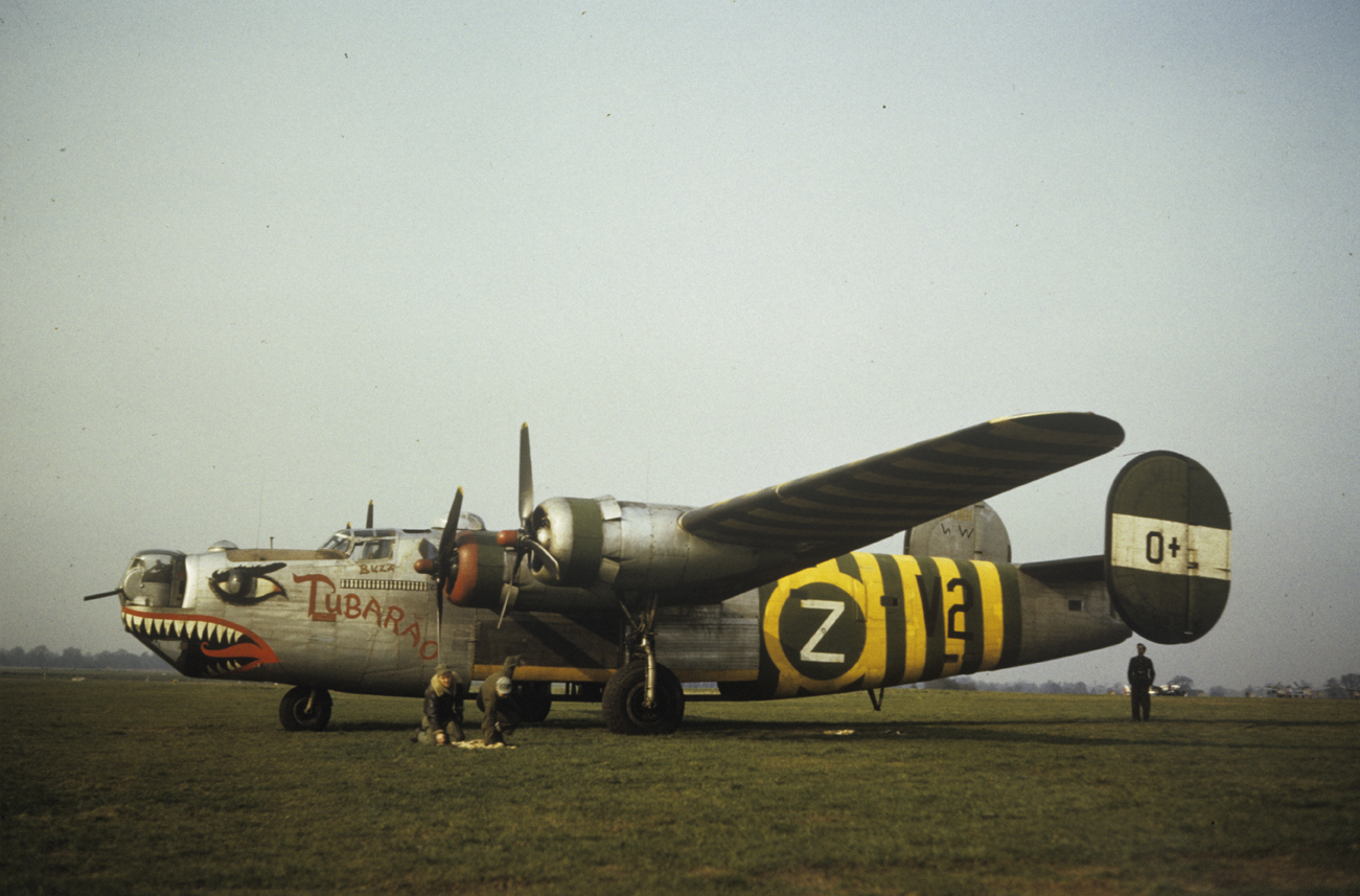 A shark mouth B-24 Liberator (serial number 44-40101, "War Weary") nicknamed "Tubarao" of the 491st Bomb Group, used as a flight assembly ship. Image by Robert Astrella. Written on slide casing: 'Tubarao, 491 BG Mount Farm.'