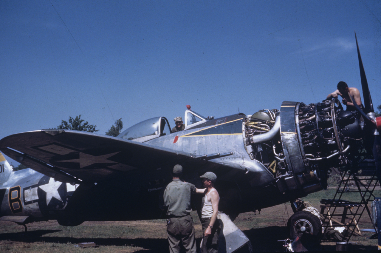 Ground personnel of the 406th Fighter Group conduct engine checks to a P-47 Thunderbolt (O7-B, serial number 42-28401) at Handorf, April 1945. Image via John Quincy. Written on slide casing: 'O7:B, 228401.'