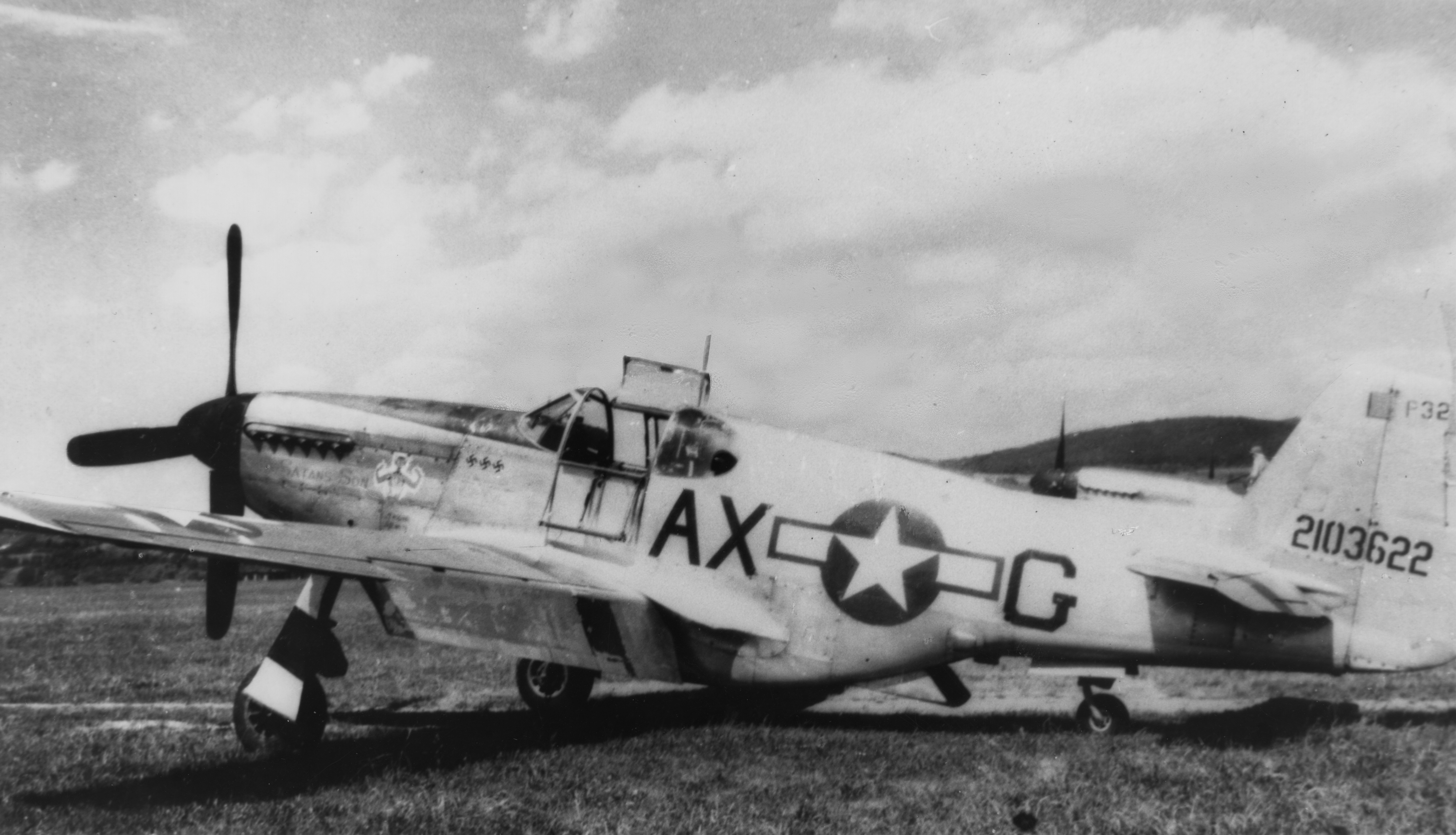 A P-51C Mustang (AX-G, serial number 42-103622) nicknamed "Satan's Son" of the 356th Fighter Squadron, 354th Fighter Group at Middle Wallop. Handwritten caption on reverse: 'Should be Middle Wallop. P-51C, 42-103622, Satan's Son, From Paul Miller.' On reverse: Merle Olmsted [Stamp].