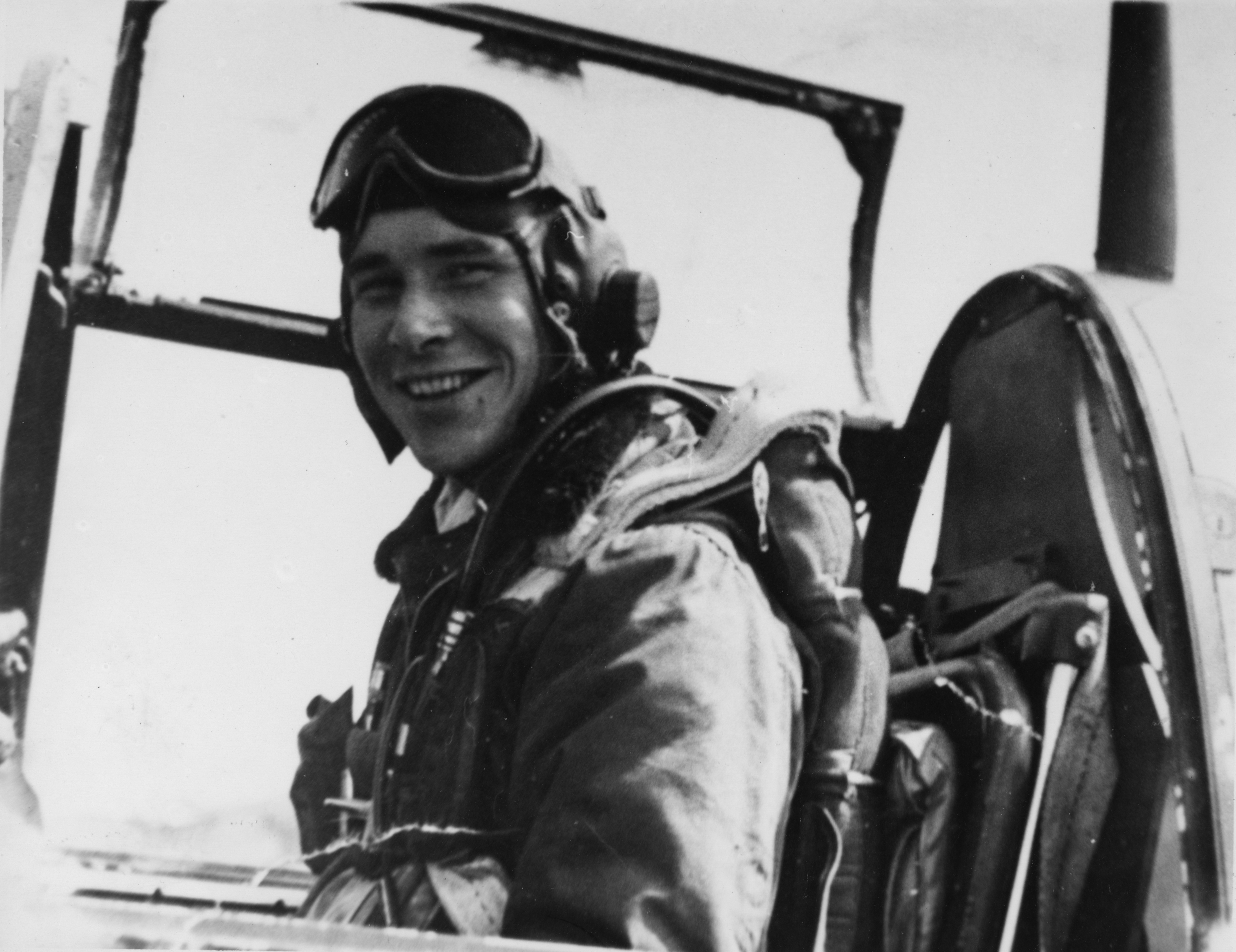 Leonard K. "Kit" Carson, of the 357th Fighter Group in the cockpit of his P-51 Mustang. Handwritten caption on reverse: 'Leonard K. Carson.'