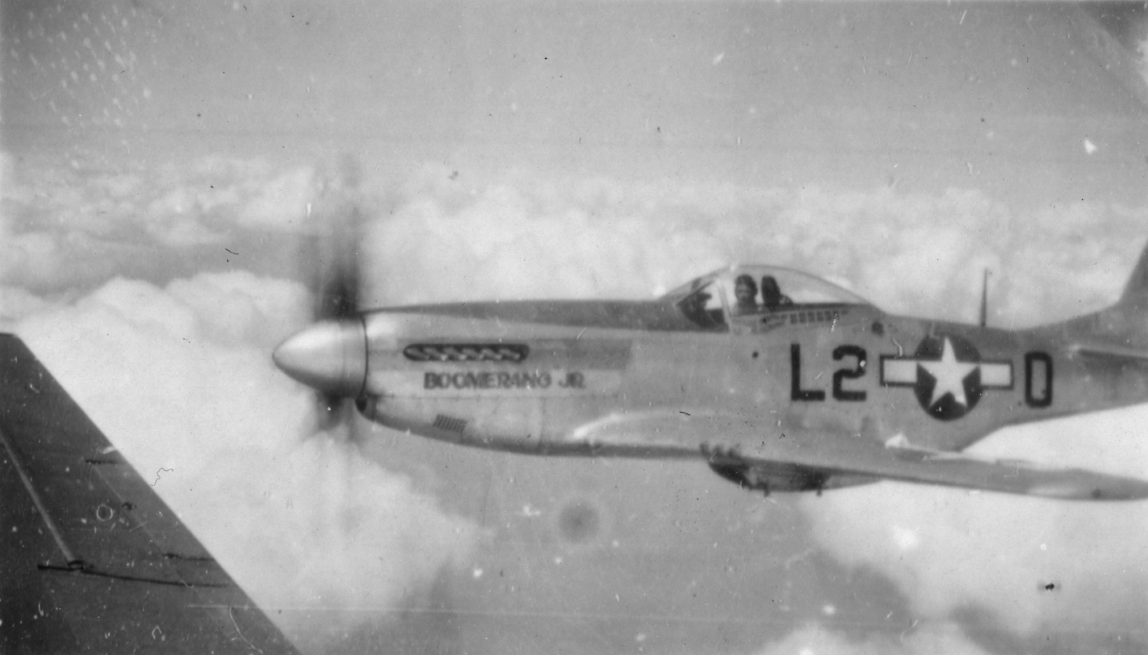 A P-51 Mustang (L2-O) nicknamed "Boomerang Jr" of the of the 434th Fighter Squadron, 479th Fighter Group in flight.