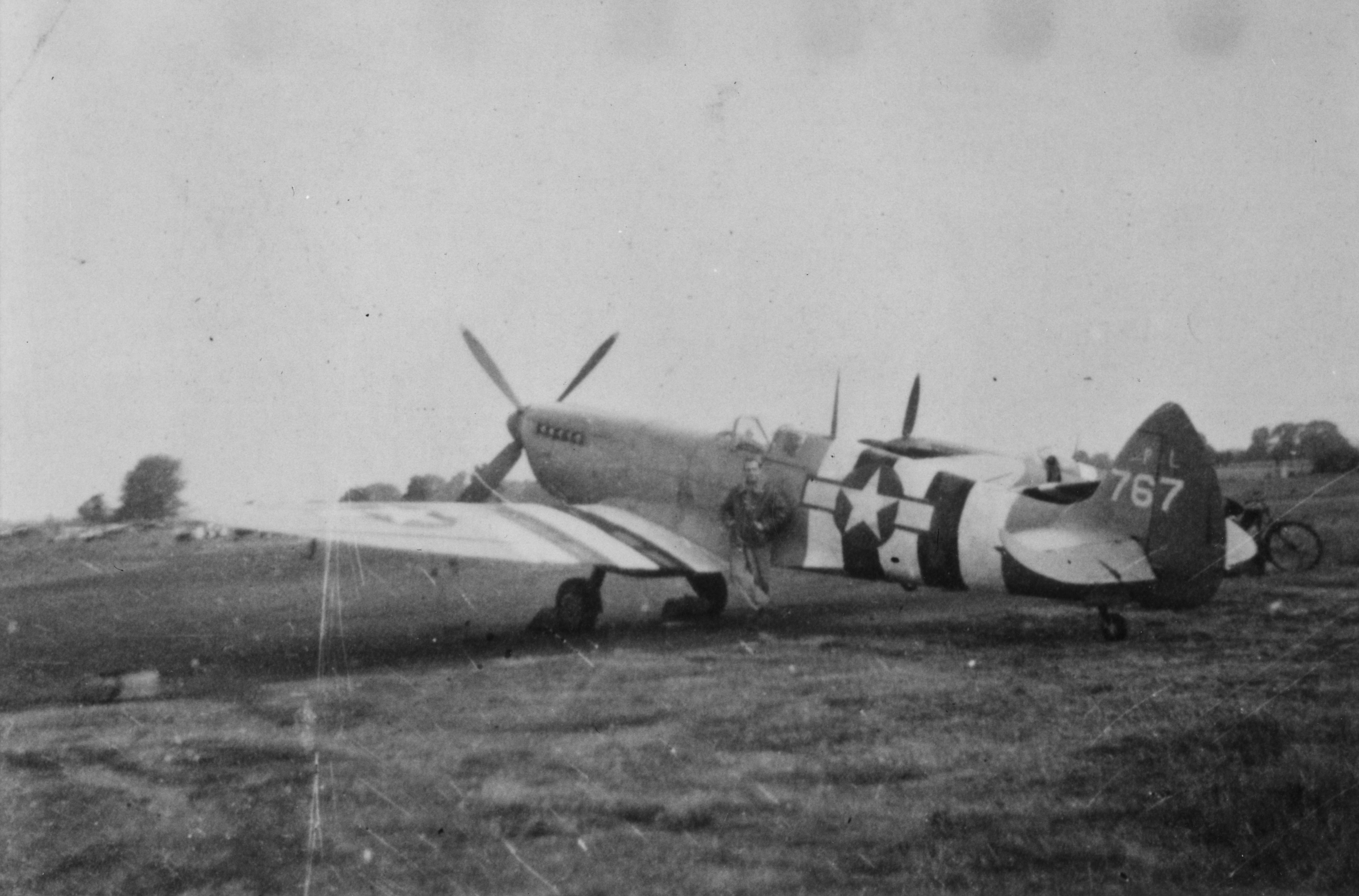 Major Haugen, of the 7th Photographic Reconnaissance Group with his Spitfire PR Mk. XI. Handwritten caption on reverse: 'Patsy Piscitelli. Major Haugen - cr. on return 13th op - 6 miles from Mount Farm.'