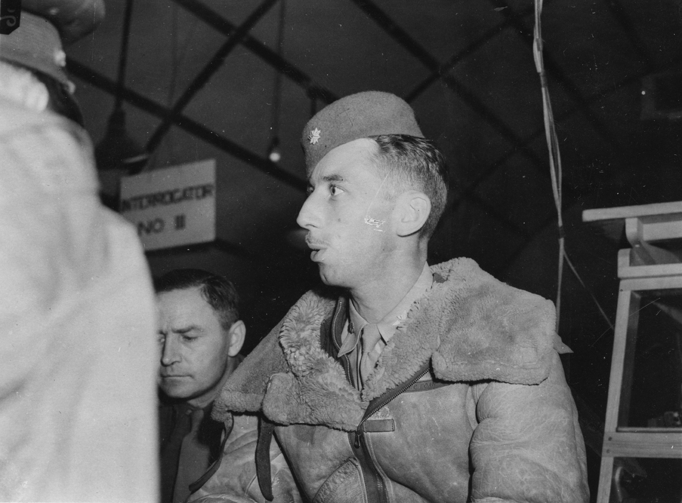 Major John C. Egan, of the 100th Bomb Group, wearing a fez on his return from the Regensburg Shuttle mission. Associated News Story: '"Arabian Knights Return": Men Who Made Shuttle-Bombing Raid On Regensburg. Wearing red fezes and carrying Arabian knives, the first contingent of airmen who participated in the shuttle-bombing raid on Regensburg returned from their temporary North African bases yesterday, August 22 - five days after the heavy attack on the Nazis' largest aircraft Messerschmidt factory. No b