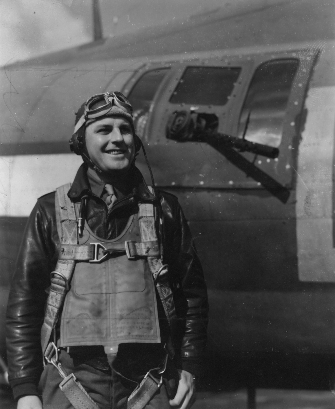 Staff Sergeant Joseph Norton, of the 324th Bomb Squadron, 91st Bomb Group, with a B-17 Flying Fortress. Image via Lieutenant Colonel Paul Chryst, 91st Bomb Group Handwritten caption on reverse: 'S/Sgt Joseph Norton, 324th BS, 91st BG.'