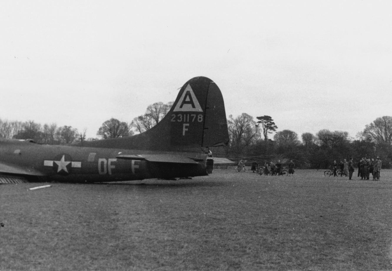 The damaged tail of a crashed B-17 Flying Fortress (DF-F, serial number 42-31178) of the 91st Bomb Group.