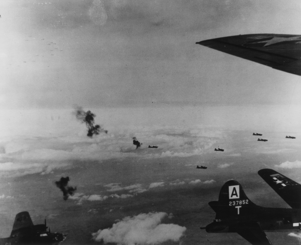 B-17 Flying Fortreses of the 94th Bomb Group fly through flak. B-17 ( serial number 42-37852) is to the right of the image. Handwritten caption on reverse: '#3.'