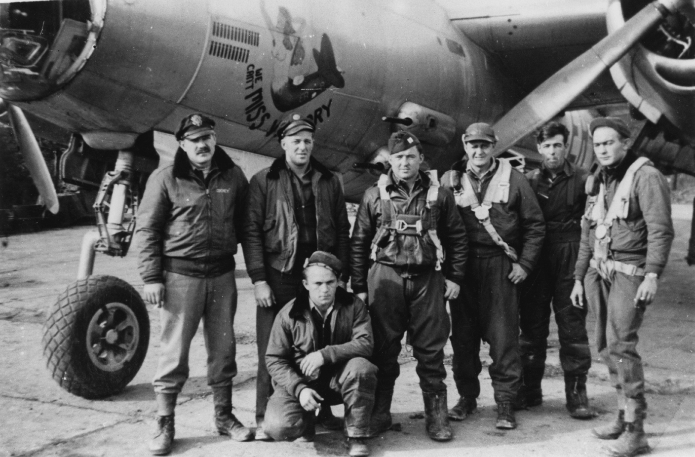 A bomber crew of the 322nd Bomb Group with a B-26 Marauder nicknamed "We Can't Miss Victory". Handwritten caption on reverse: 'Via P. Dale.'