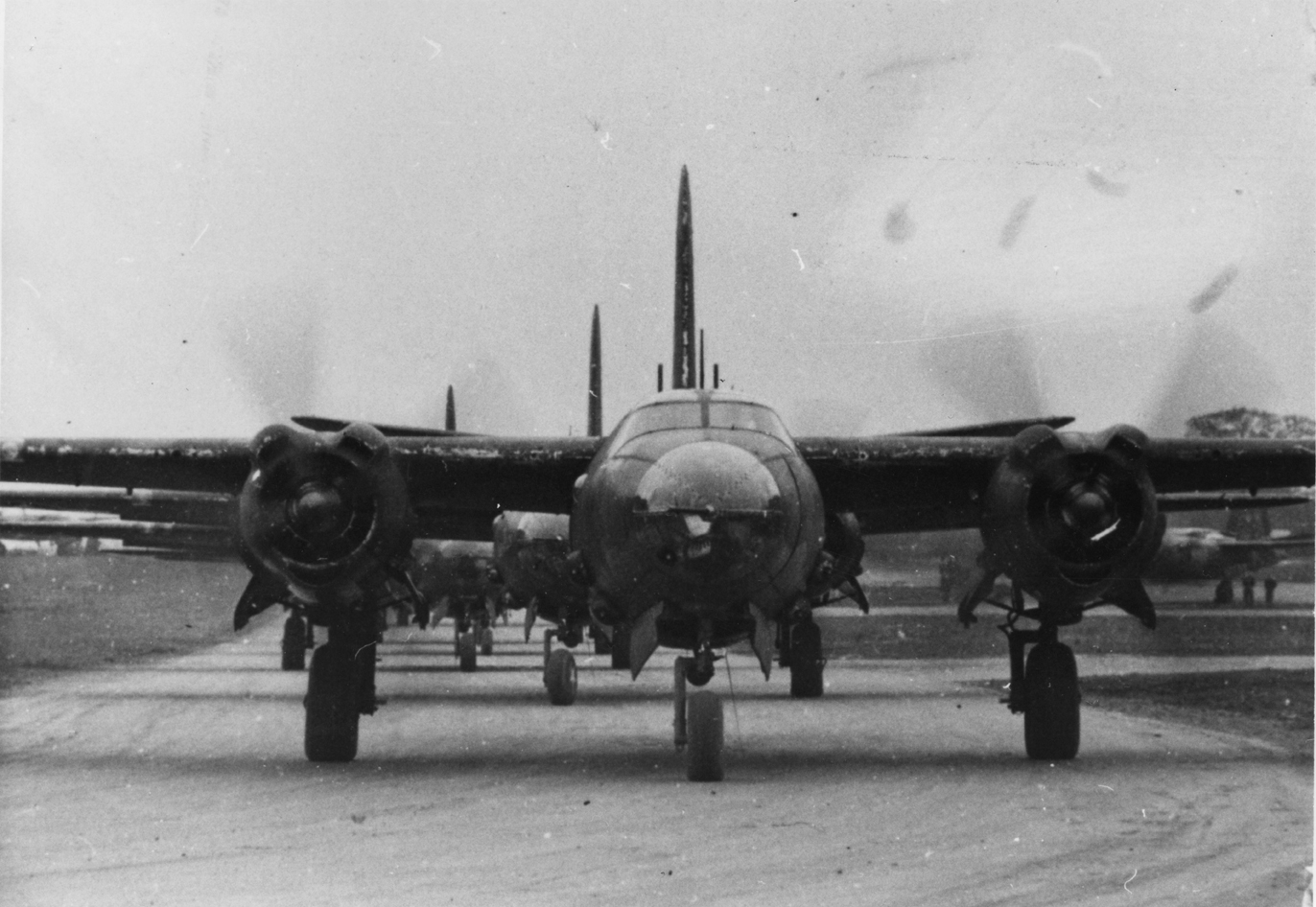 B-26 Marauders of the 322nd Bomb Group line up for take off. Handwritten caption on reverse: '322BG.'