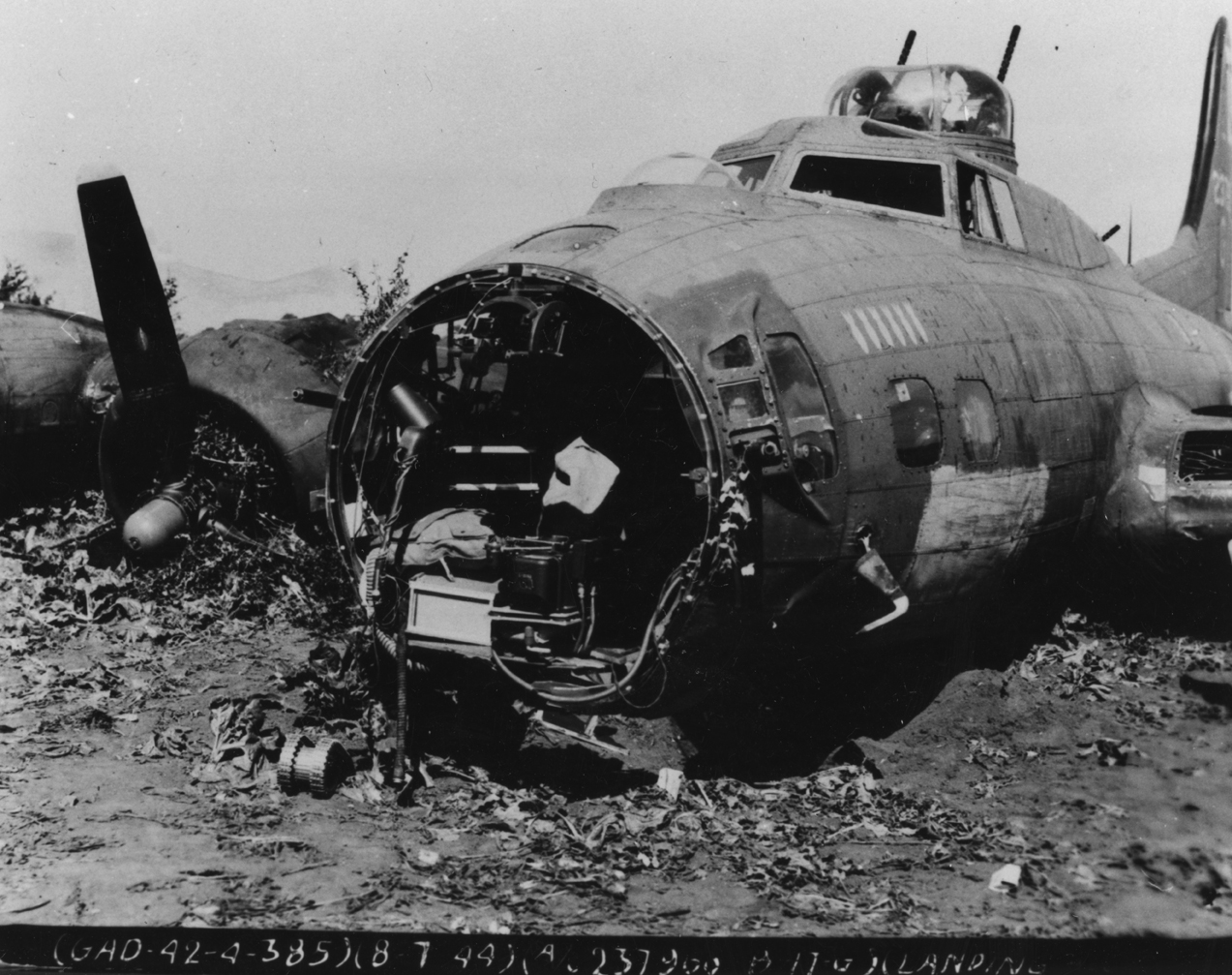 The wreck of a B-17G Flying Fortress (serial number 42-37966) of the 385th Bomb Group, 8 July 1944. Official caption on image: "(GAD-42-4-385)(8-7-44)(A/C 237966 - B-17G)(Landing[obscured.]"