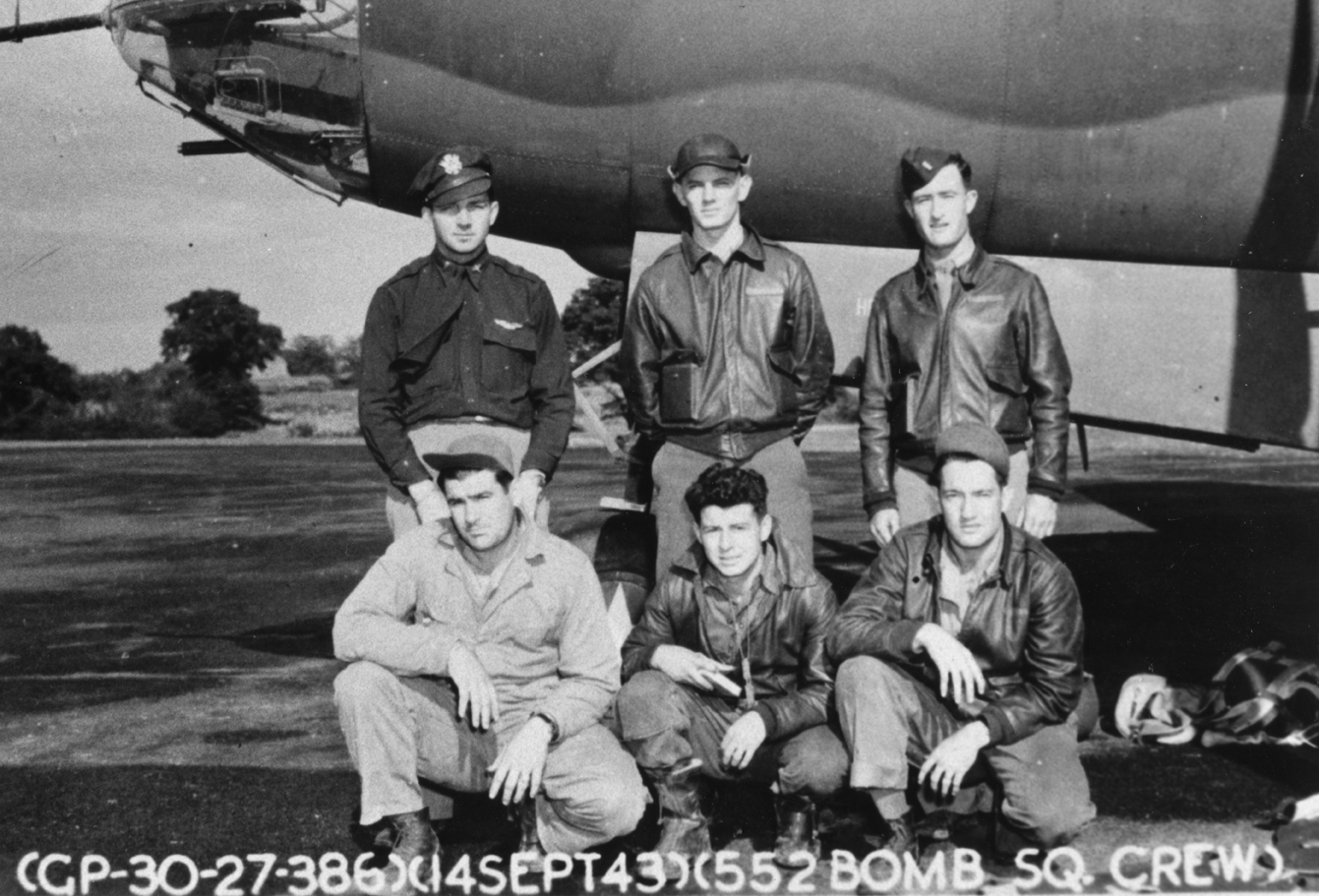 A bomber crerw of the 552nd Bomb Squadron, 386th Bomb Group with their B-26 Marauder (RG-K, serial number 41-34987). Official caption on image: "(GP-30-27-386)(14 Sept 43)(552 Bomb Sq. Crew)." Printed caption on reverse: '552nd B.S., 386th B.G. A/C Name: _ A/C Ser. No.: 134987, RG-K. From left to right starting in back row: 1) Pilot: Gerold A. Wendt. 2) _. 3) _. 4) E/G: Thornton B. Henry. 5) A/G: Myron O. McKim. 6) R/G: _.' On reverse: From Photo Files Of Chester P. Klier [Stamp].