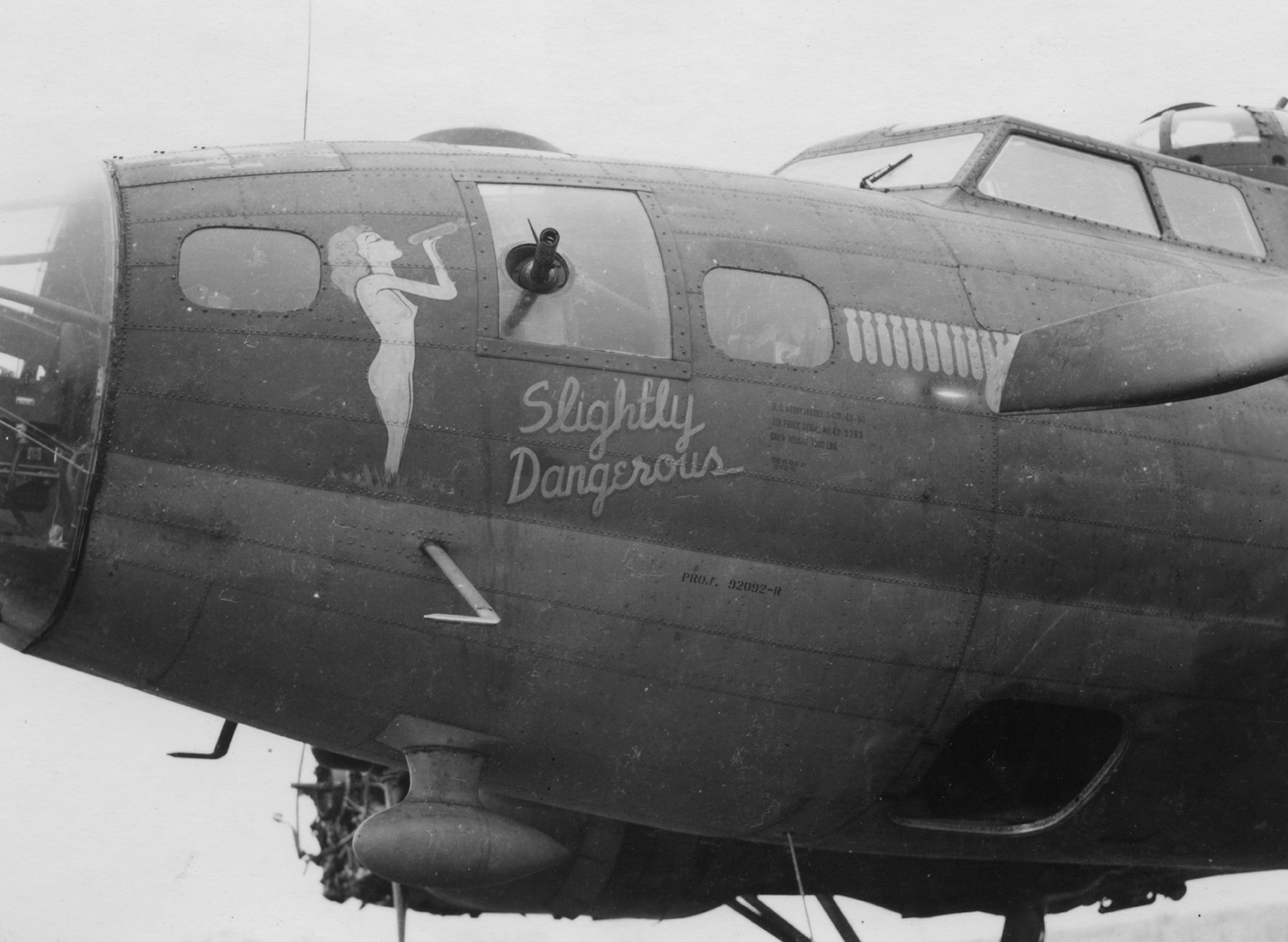 The nose art of a B-17 Flying Fortress nicknamed "Slightly Dangerous" of the 388th Bomb Group. Handwritten caption on reverse: '388th BG?'