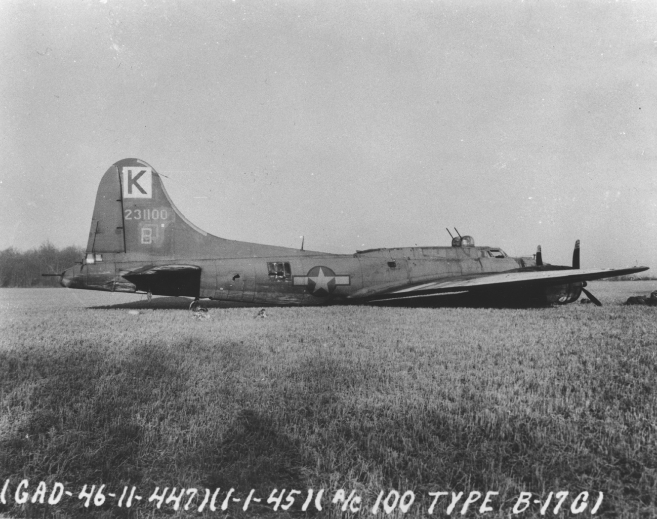 A crashed B-17G Flying Fortress (serial number 42-31100) of the 447th Bomb Group, 1 January 1945. Official caption on image: "(GAD-46-11-447)(1-1-45)(A/C 100 Type B-17G)."