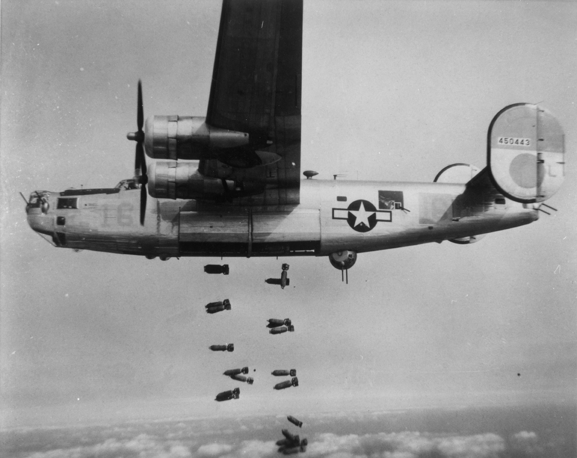 A B-24 Liberator (serial number 44-450443) of the 451st Bomb Group, 15th Air Force releases bombs during a mission.