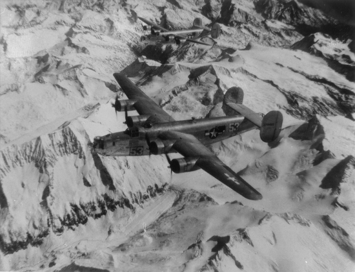 A B-24 Liberator (serial number 42-78465) nicknamed "Patches" of the 451st Bomb Group, 15th Air Force in flight. Handwritten caption on reverse: 'B-24G.'