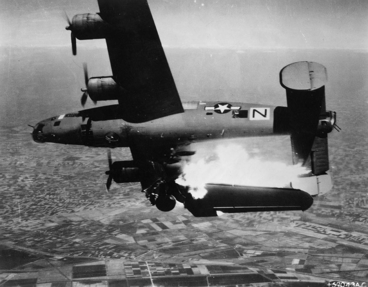 A pathfinder B-24 Liberator (serial number 44-49710) nicknamed "Stevonovitch II (Black Nan)" of the 464th Bomb Group, 15th Air Force explodes and rolls over in midair as a result of a direct flak hit, during a mission over Lugo, Italy, 10 April 1945.