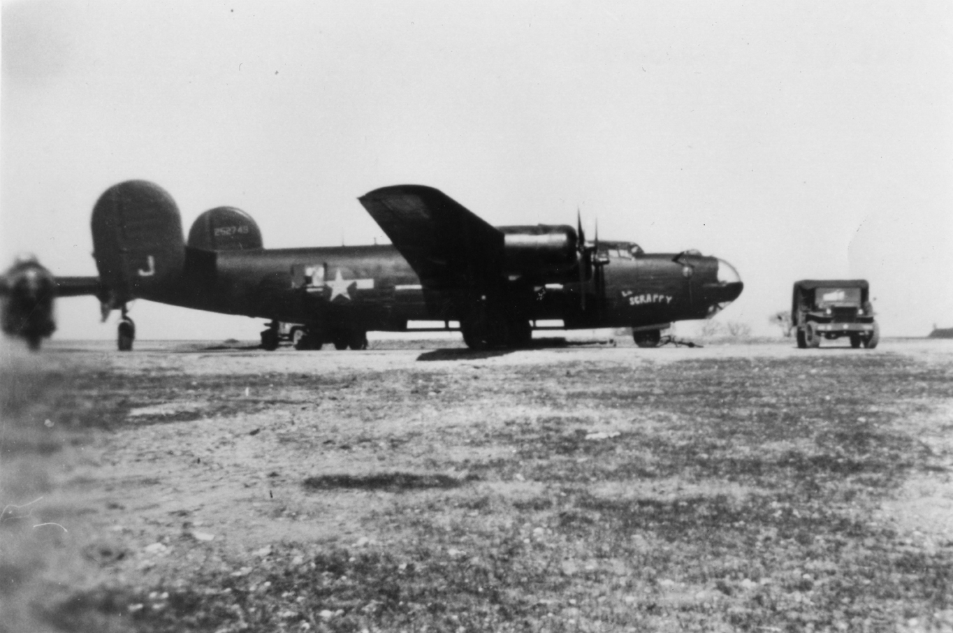 A B-24 Liberator (serial number 42-52749) nicknamed "Scrappy" of the 492nd Bomb Group. Image via Andre Pecquet. First handwritten caption on reverse: 'B-24H-15-FO "Scrappy" 492 BG- Harrington- March 1945.' Second handwritten caption on reverse: 'Harrington 1944. <-?'