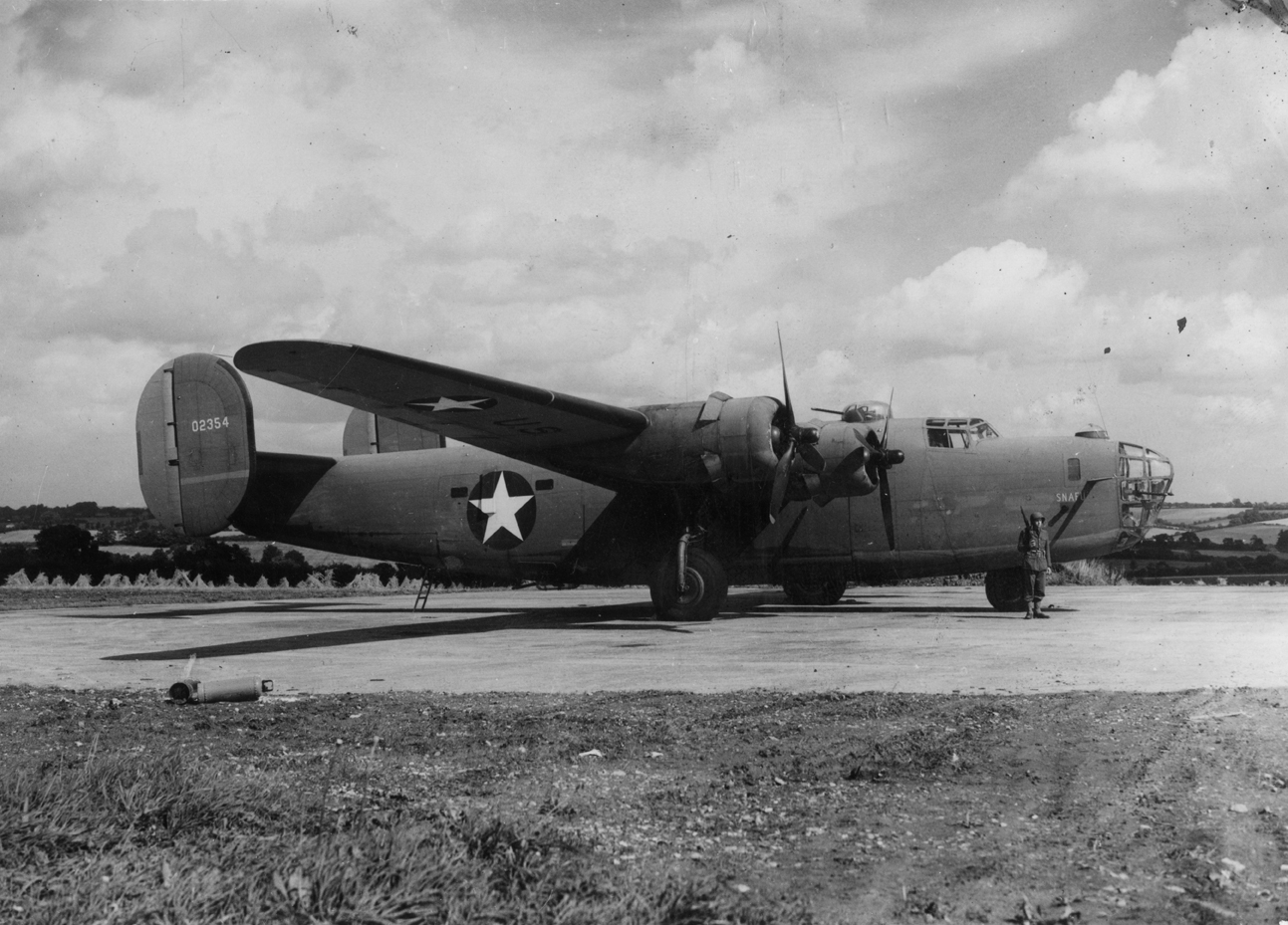 B-24 Liberator (serial number 40-2354) nicknamed "SNAFU" of the 44th Bomb Group Image stamped on reverse: 'Not to be published 5 Sep 1942.' [stamp] and '219925.' [Censor no.] A printed caption was previously attached to the reverse however this has been removed.