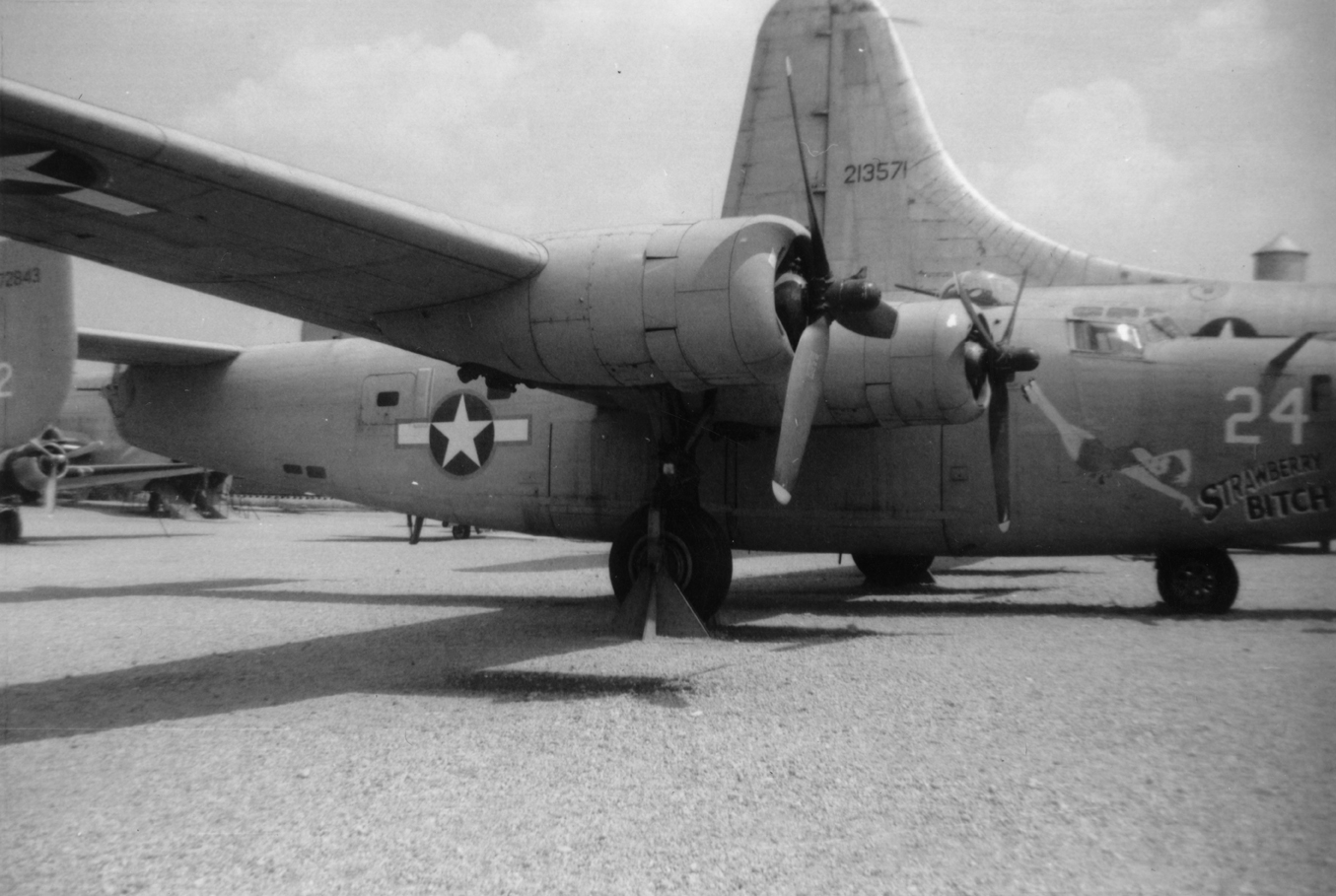 A restored B-24 Liberator painted to represent (serial number 42-72843) nicknamed "Strawberry Bitch" of the 376th Bomb Group, 15th Air Force. First hadwritten caption on reverse: 'Taken Aug 9, 1961 Air Force Museum, WPAFB, Ohio.' Second handwritten caption on reverse: '98 or 376 BG?' 