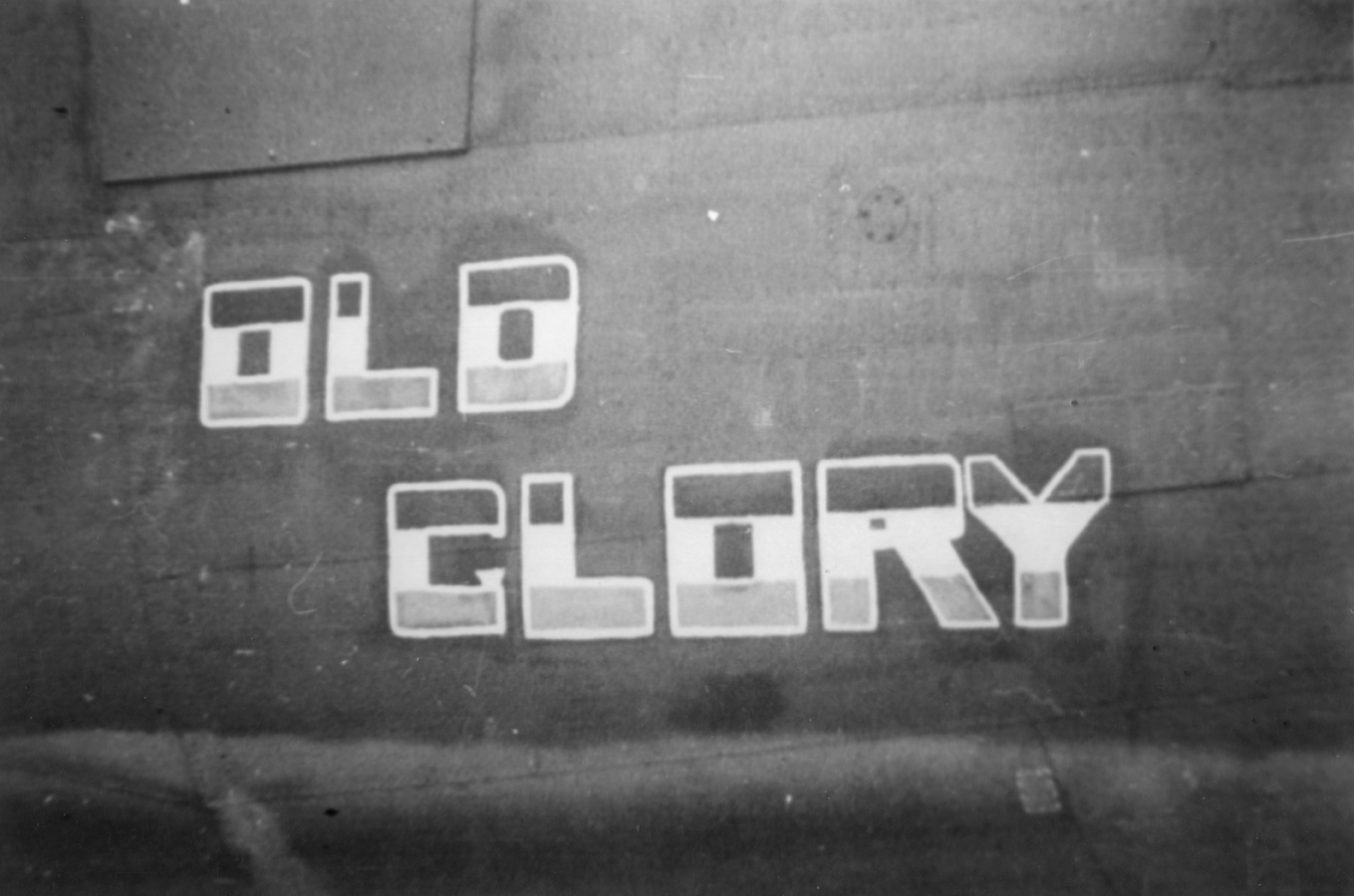 The nose art of a B-24 Liberator (serial number 42-100372) nicknamed "Old Glory" of the 389th Bomb Group. Handwritten on front of image: '2 Div B-24. Red, white and blue, 8th AF.'