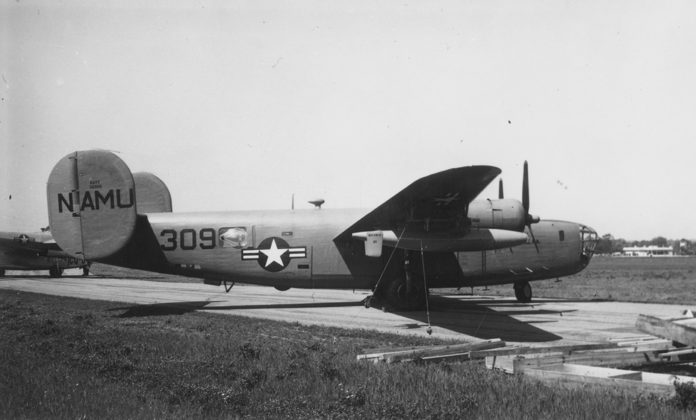 A PB74 variant B-24 Liberator (serial number 43-2305) of the Naval Air Modiciation Unit, used for evaluating missiles and drones during test flights. Handwritten caption on reverse: 'PB47-1, 32305.'