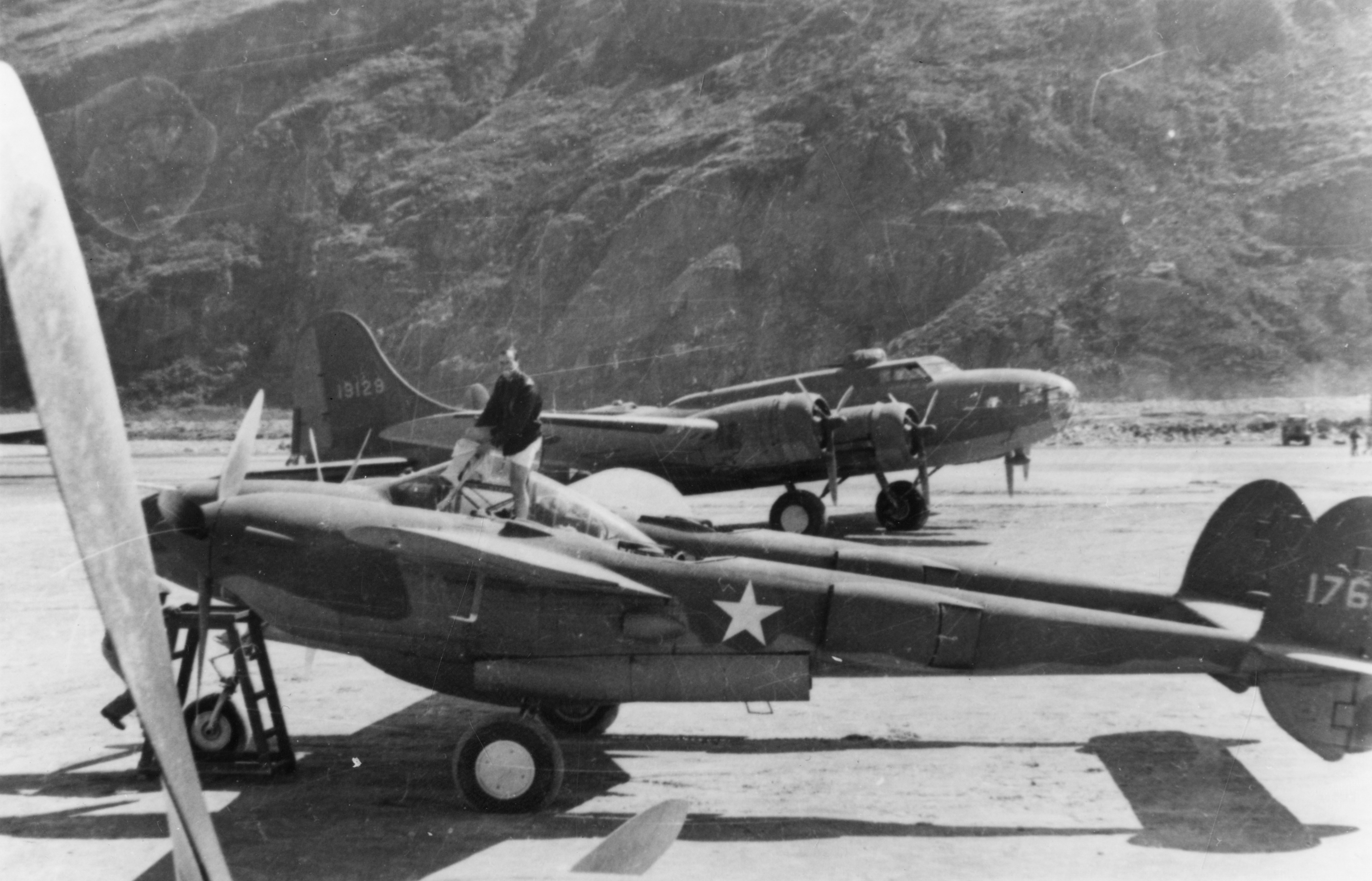 A P-38 Lightning and a B-17 Flying Fortress (serial number 41-9129) of the 305th Bomb Group.