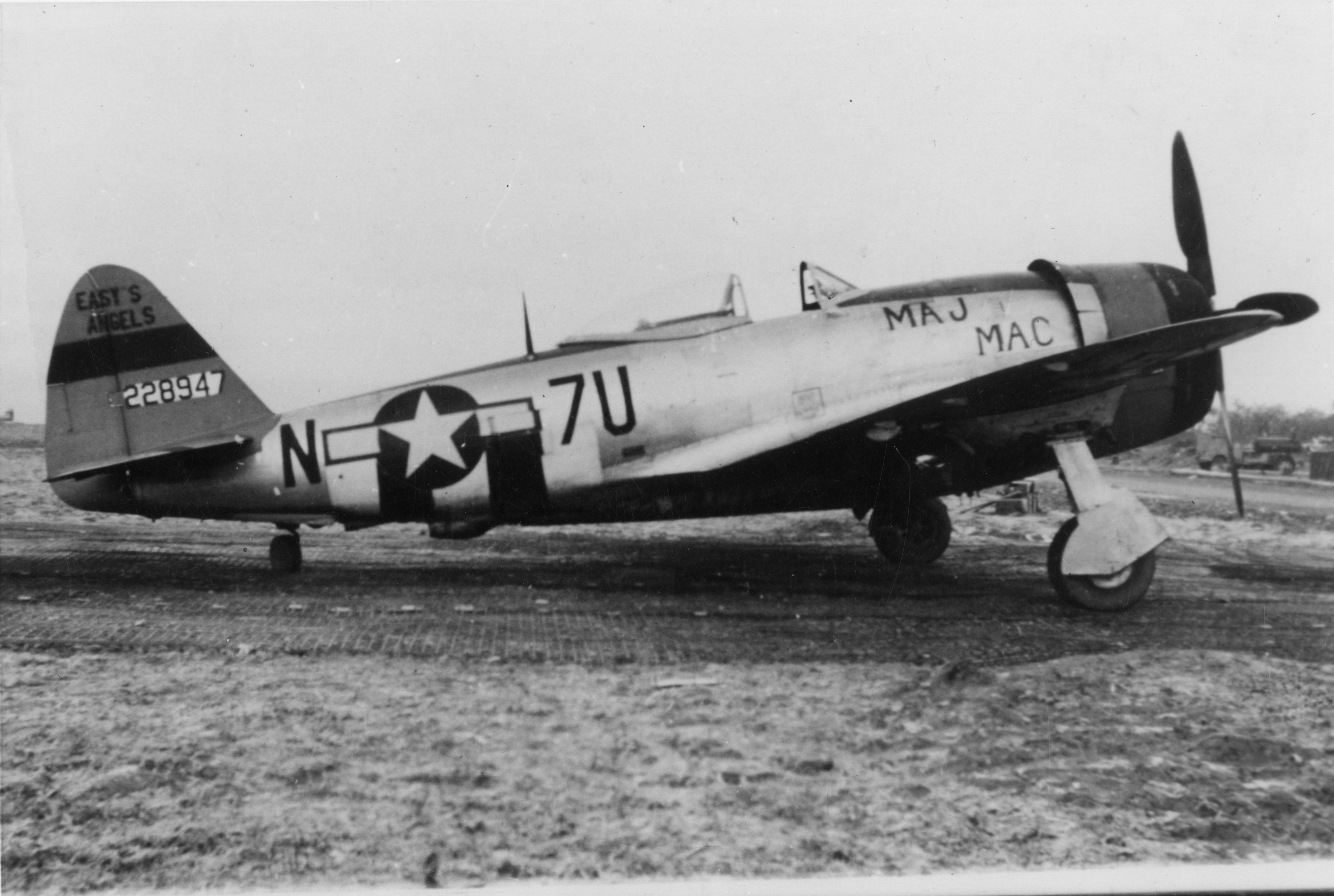 A P-47 Thunderbolt (serial number 42-28947) nicknamed "Maj Mac" of the 36th Fighter Group. Handwritten caption on reverse: '23rd Sqn, 36th FG, Pilot: Lt MW "Maggie" Magnusson, photo to Major.'