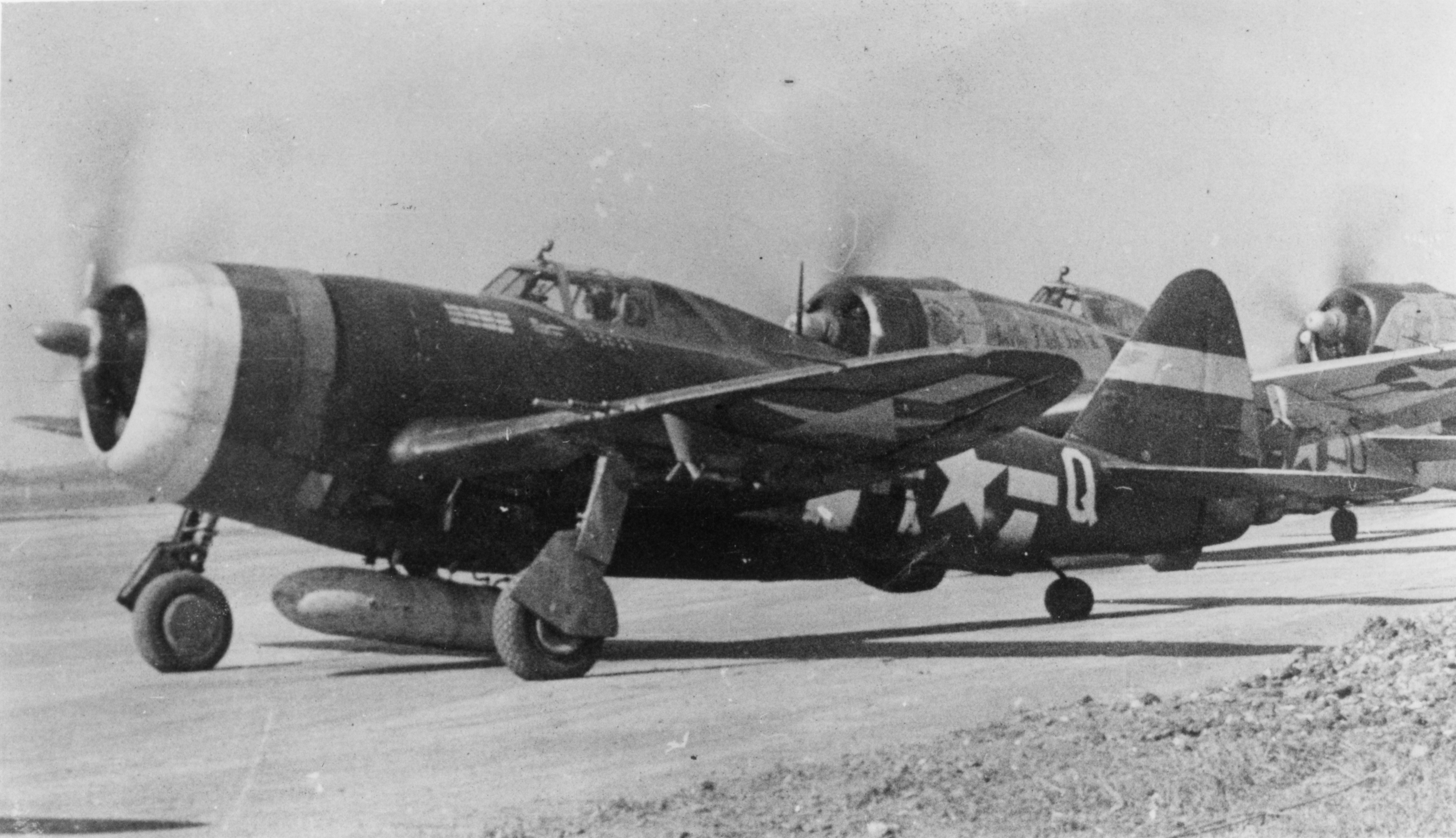 P-47 Thunderbolts of the 365th Fighter Group line up for take off. Handwritten caption on reverse: '365 FG not Gosfield, post 7/44.'