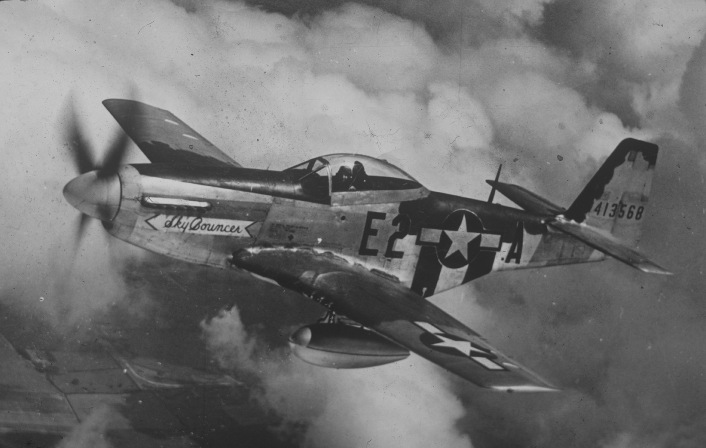 A 375th Fighter Squadron, 361st Fighter Group P-51 Mustang (E2-A, serial number 44-13568) nicknamed "Sky Bouncer" in flight. Handwritten on slide casing: '361st F.G.'